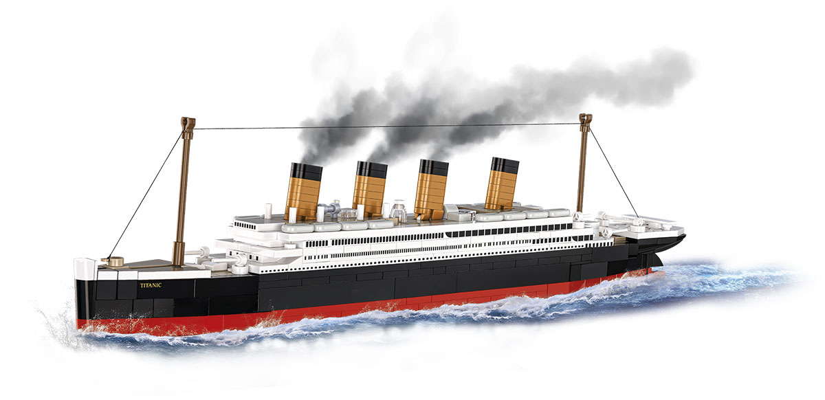 Ein Spielzeugmodell des Titanic-Schiffs vor weißem Hintergrund.