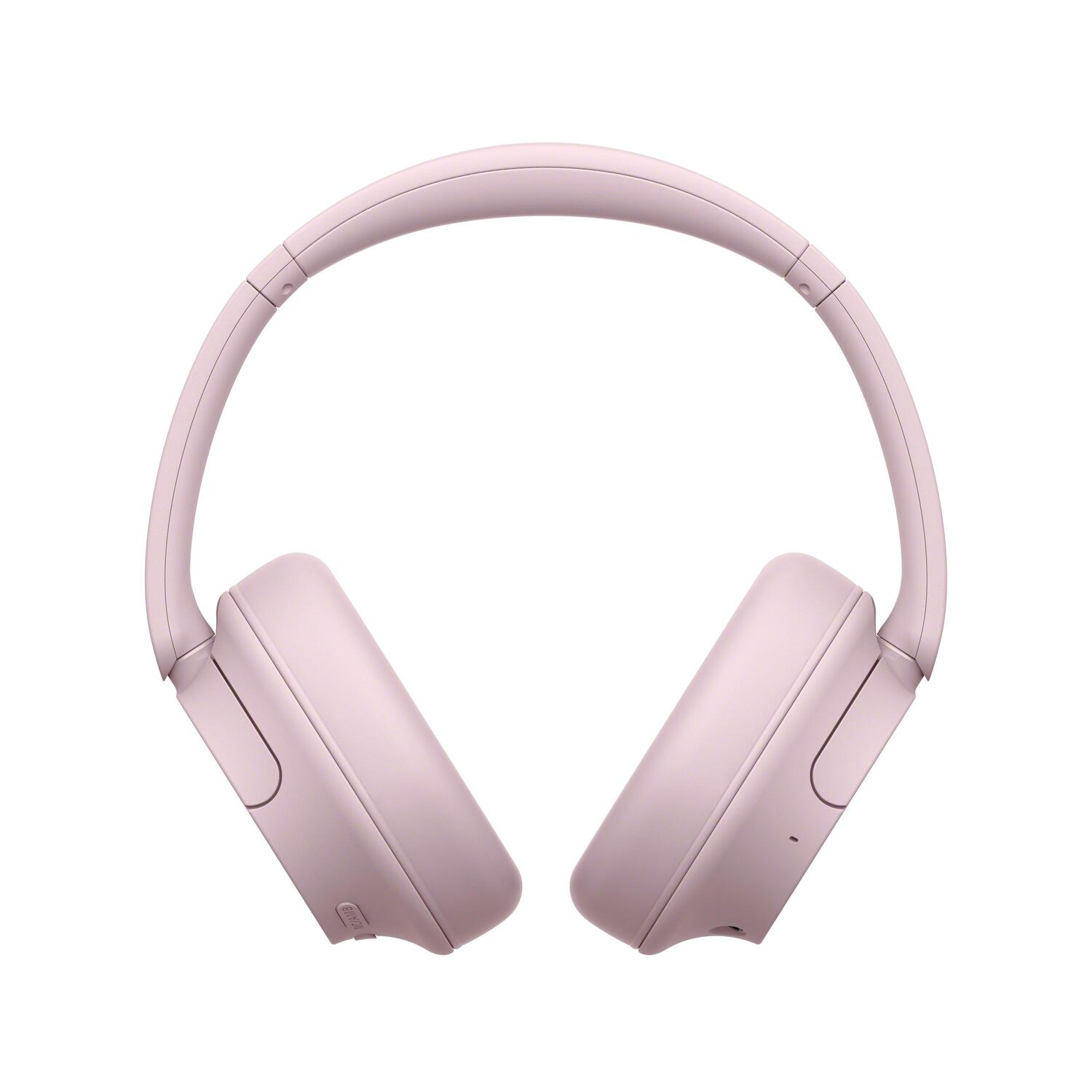 Casque rose, vue de face, fond blanc.