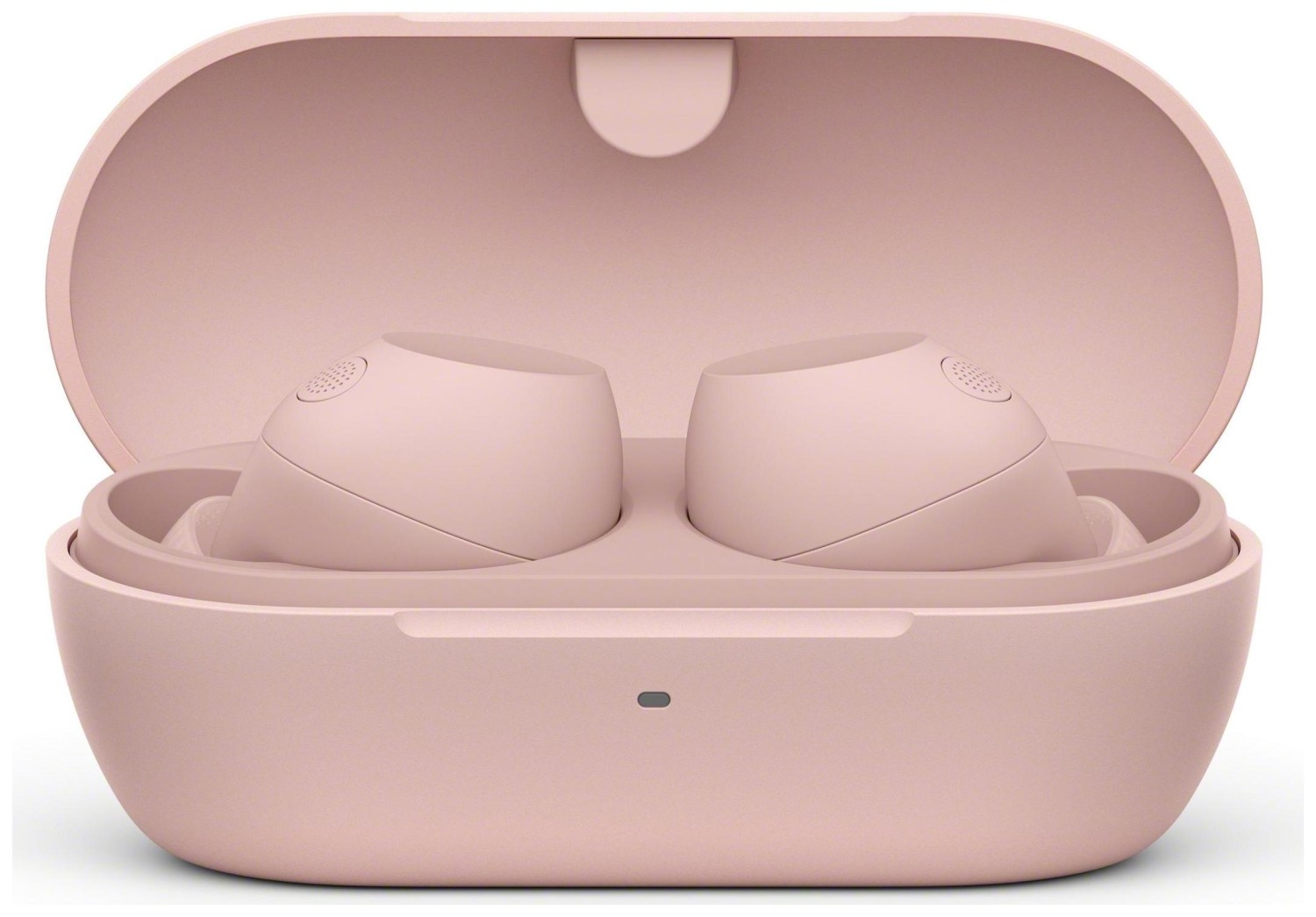 Różowe słuchawki w otwartym etui ładującym. Etui jest również różowe.
