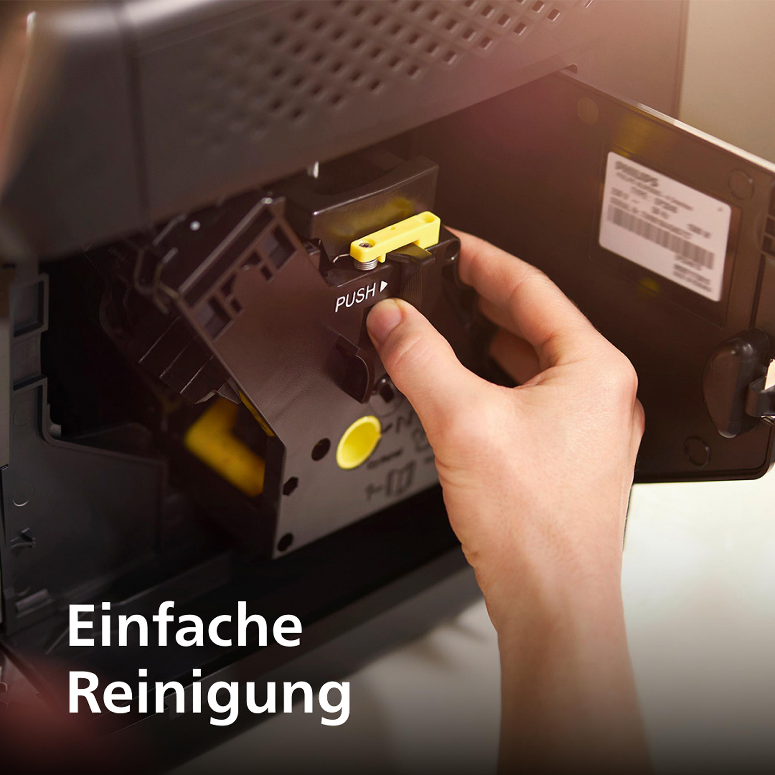 Hand entfernt die Kaffeebrüheinheit aus einer Philips Kaffeemaschine.