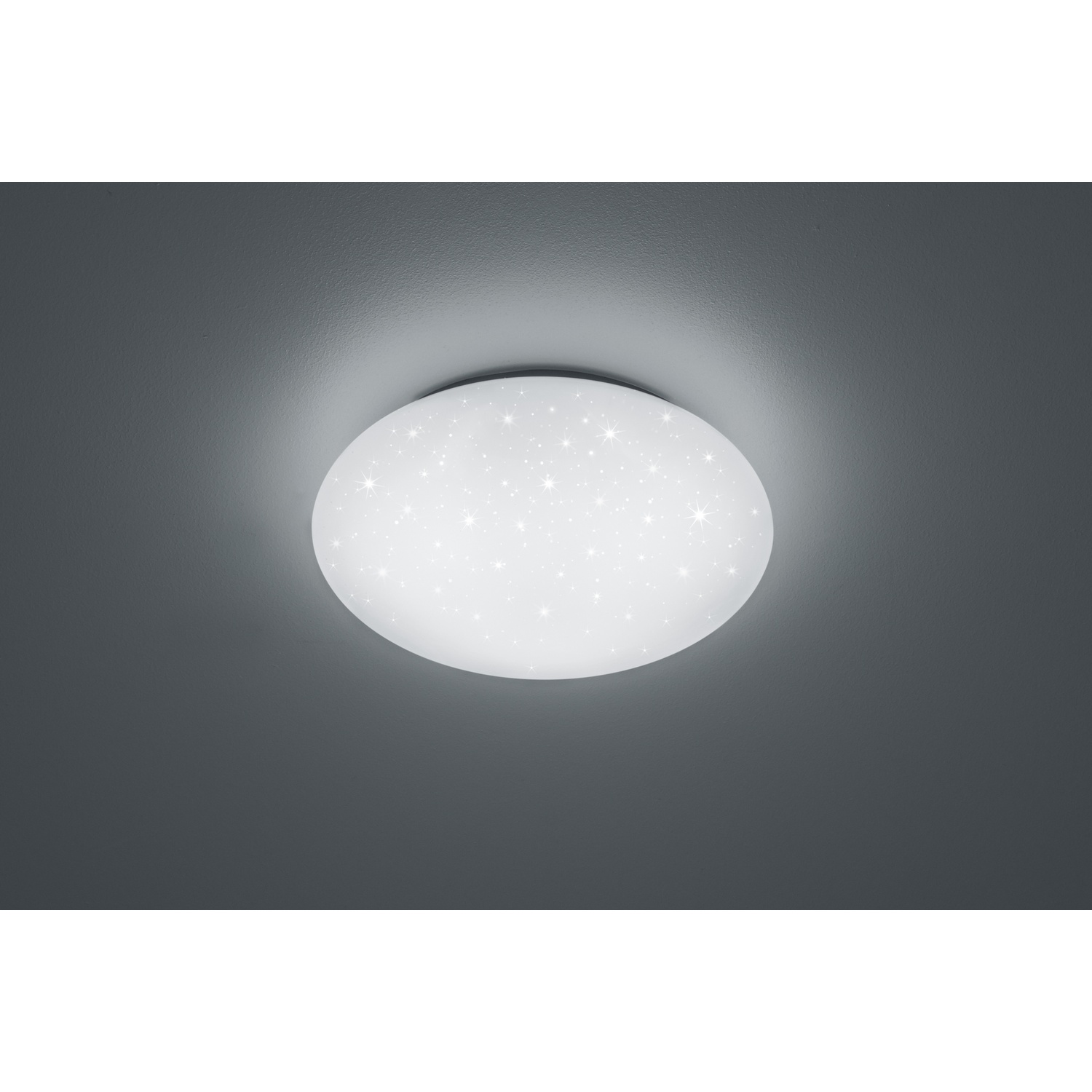 Lampada da soffitto rotonda con motivo a stelle su sfondo grigio scuro.