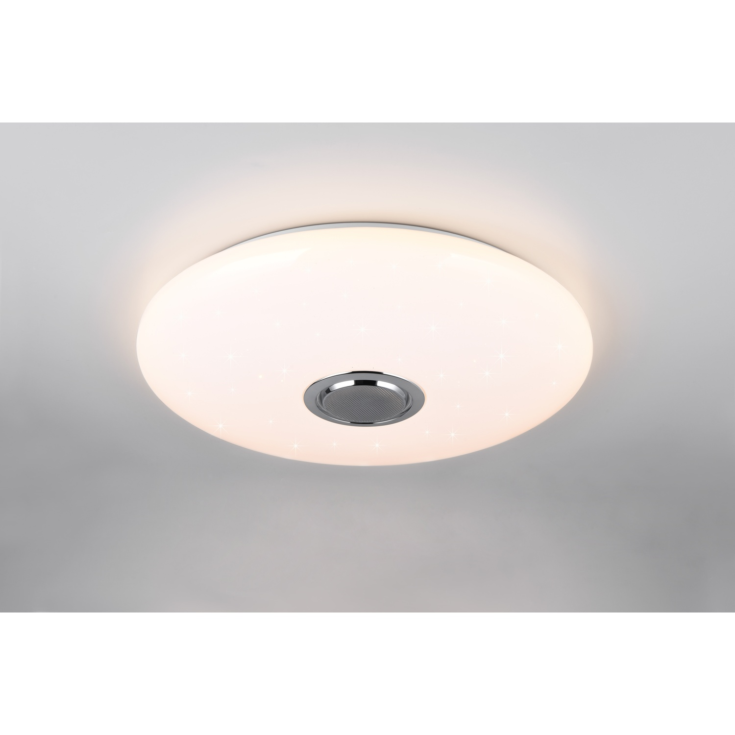Lampada da soffitto rotonda bianca con un altoparlante al centro.
