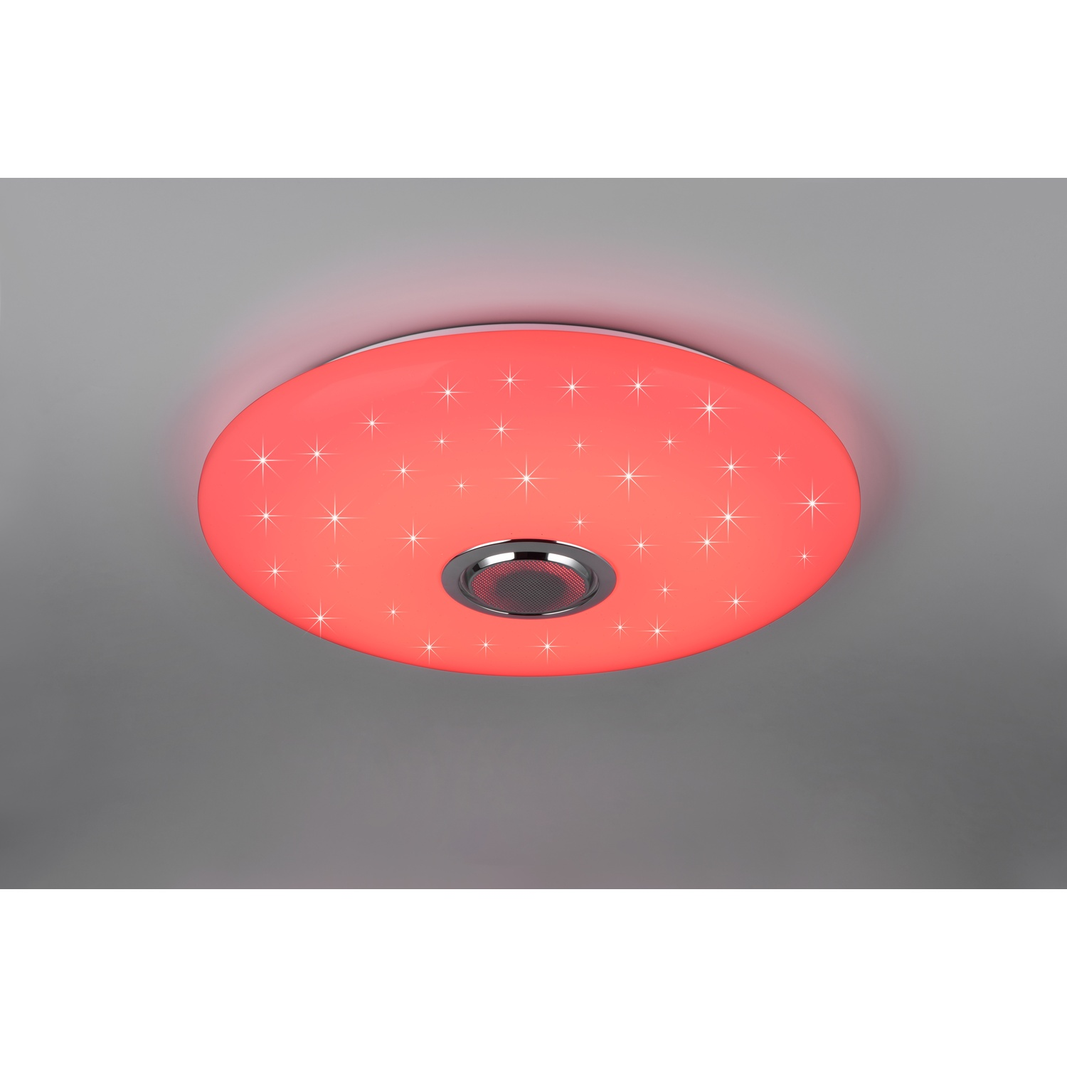 Una lampada da soffitto rotonda rossa con design a stelle e un altoparlante argentato.