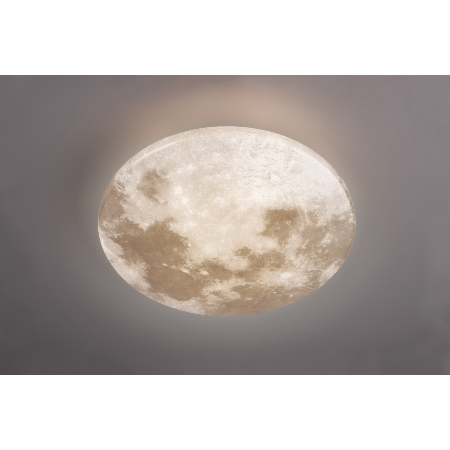Un apparecchio di illuminazione rotondo a forma di luna su sfondo grigio, con un bagliore centrale brillante.