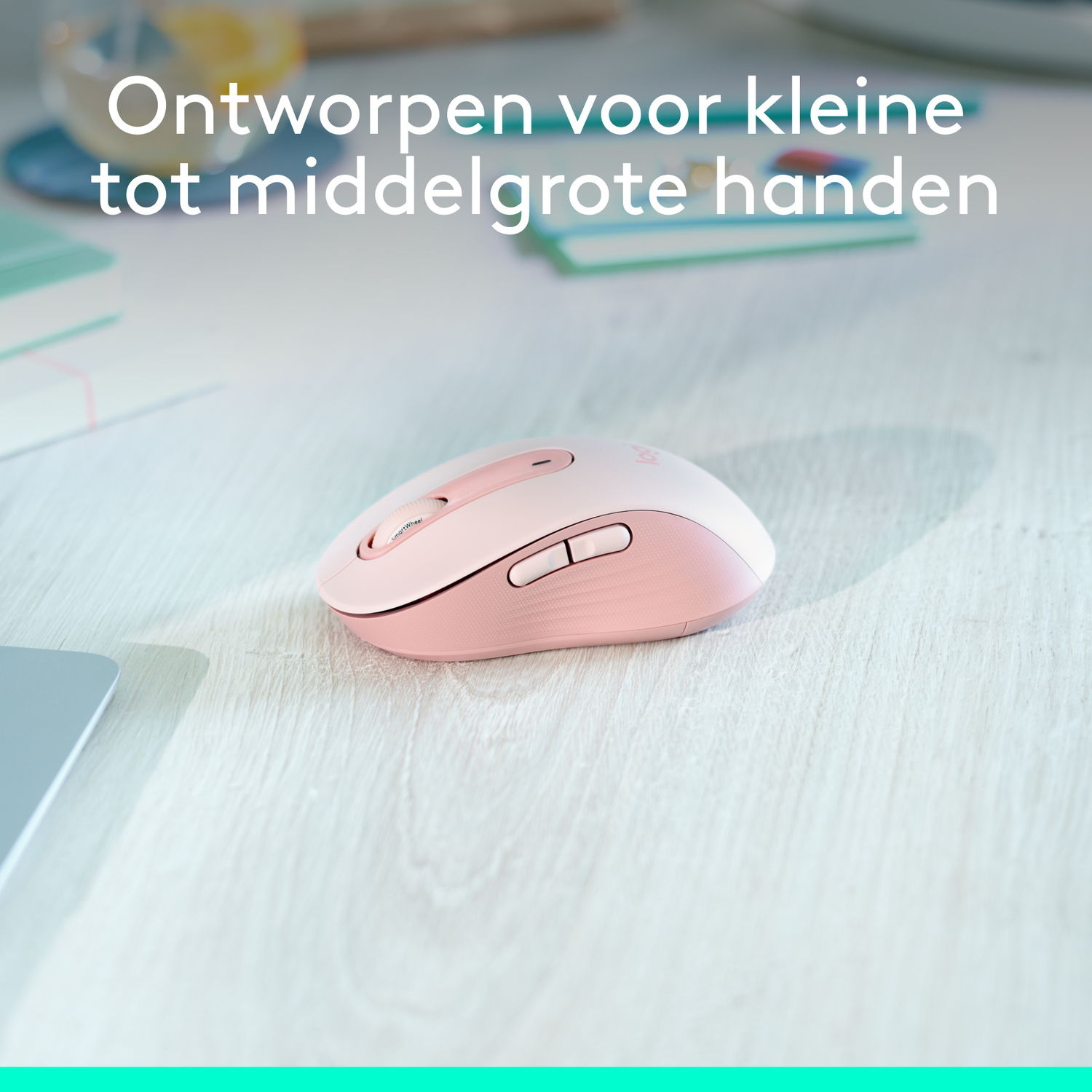 A pink computer mouse with the Bluetooth and USB symbols on a teal background.