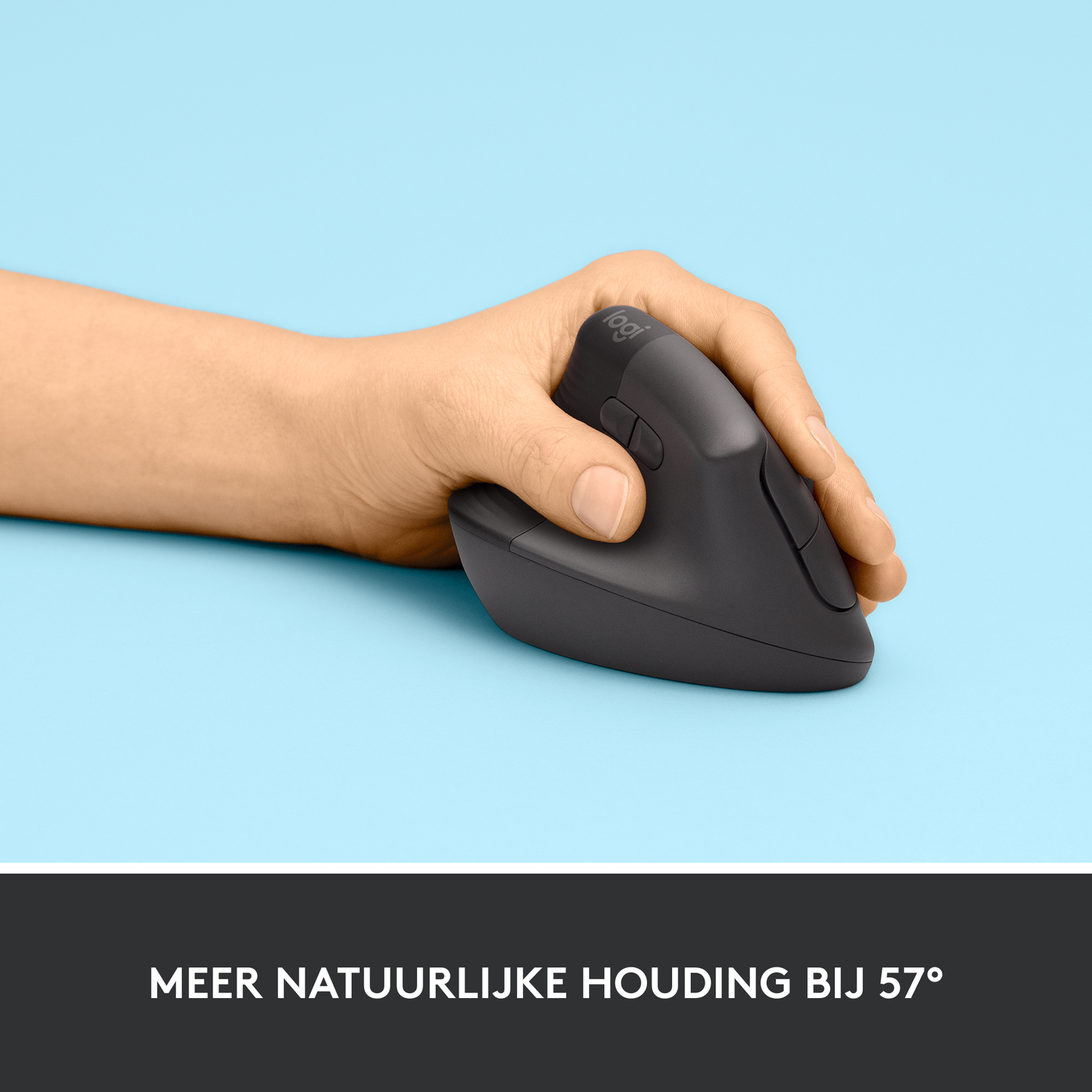 Black ergonomic mouse held in a person's hand on a blue background.