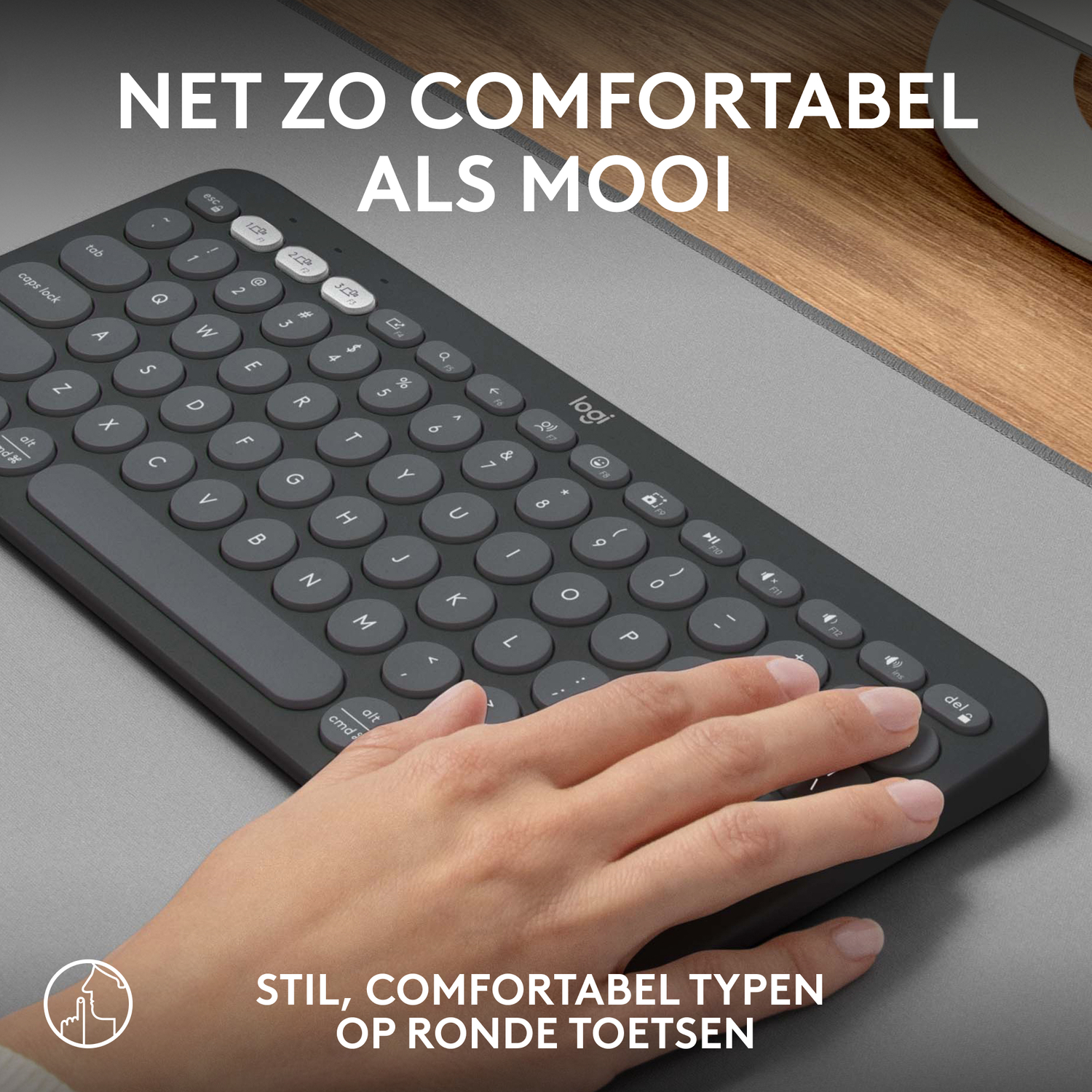 Keyboard, hand. Text: As comfortable as beautiful. Stylish, comfortable typing on round keys.