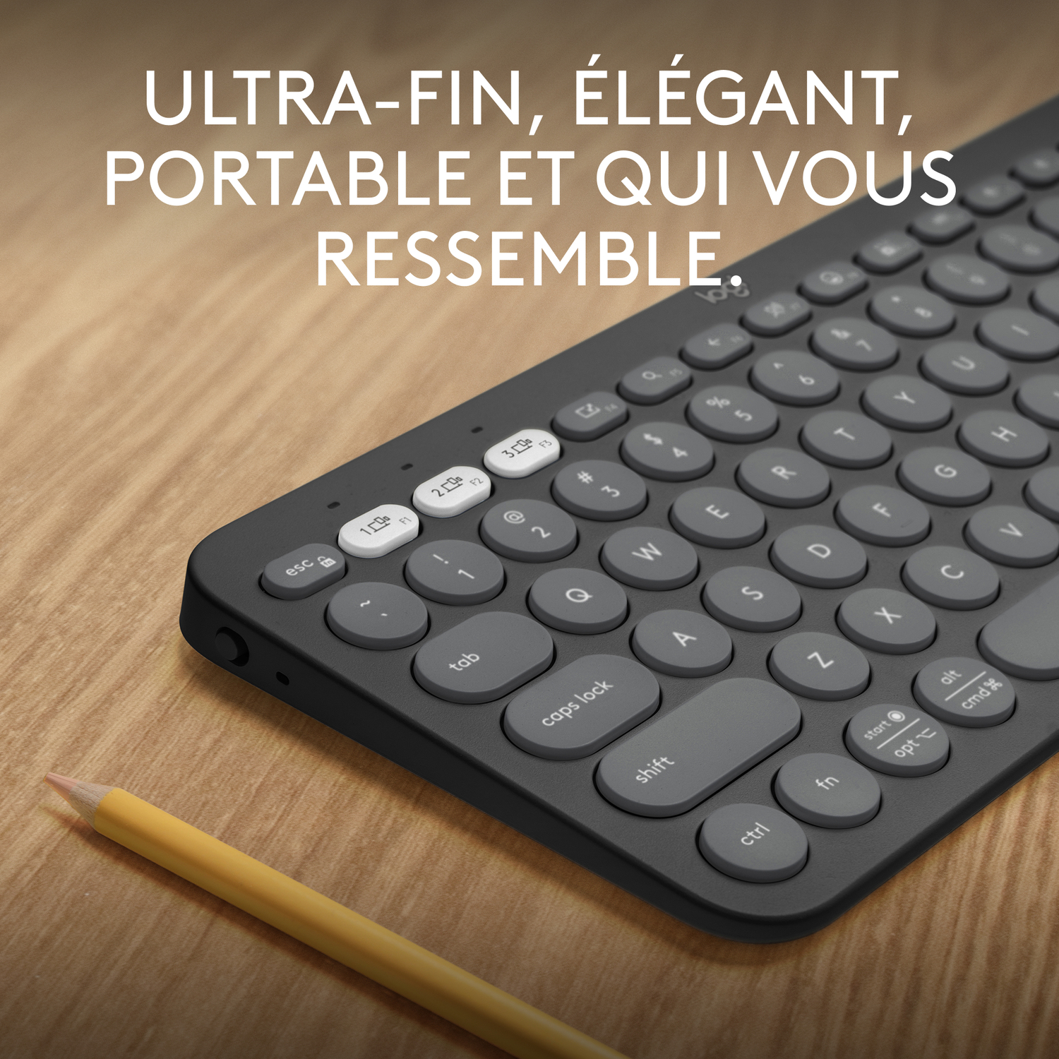Clavier noir, touches rondes, texte 'ULTRA-FIN, ÉLÉGANT...'