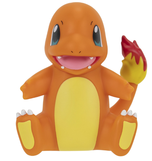 Ein lächelndes, orangefarbenes Charmander-Spielzeug mit rotem Flammen-Schwanz.