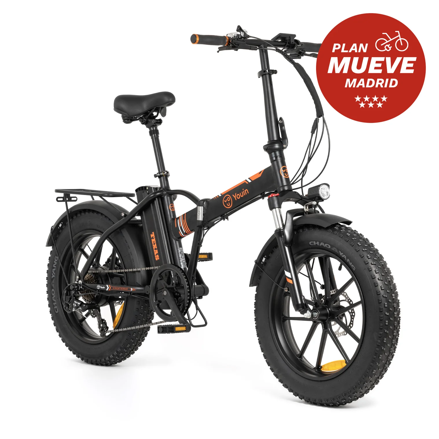 Bicicleta eléctrica negra con detalles naranjas, neumáticos grandes y un círculo rojo de promoción de Madrid.