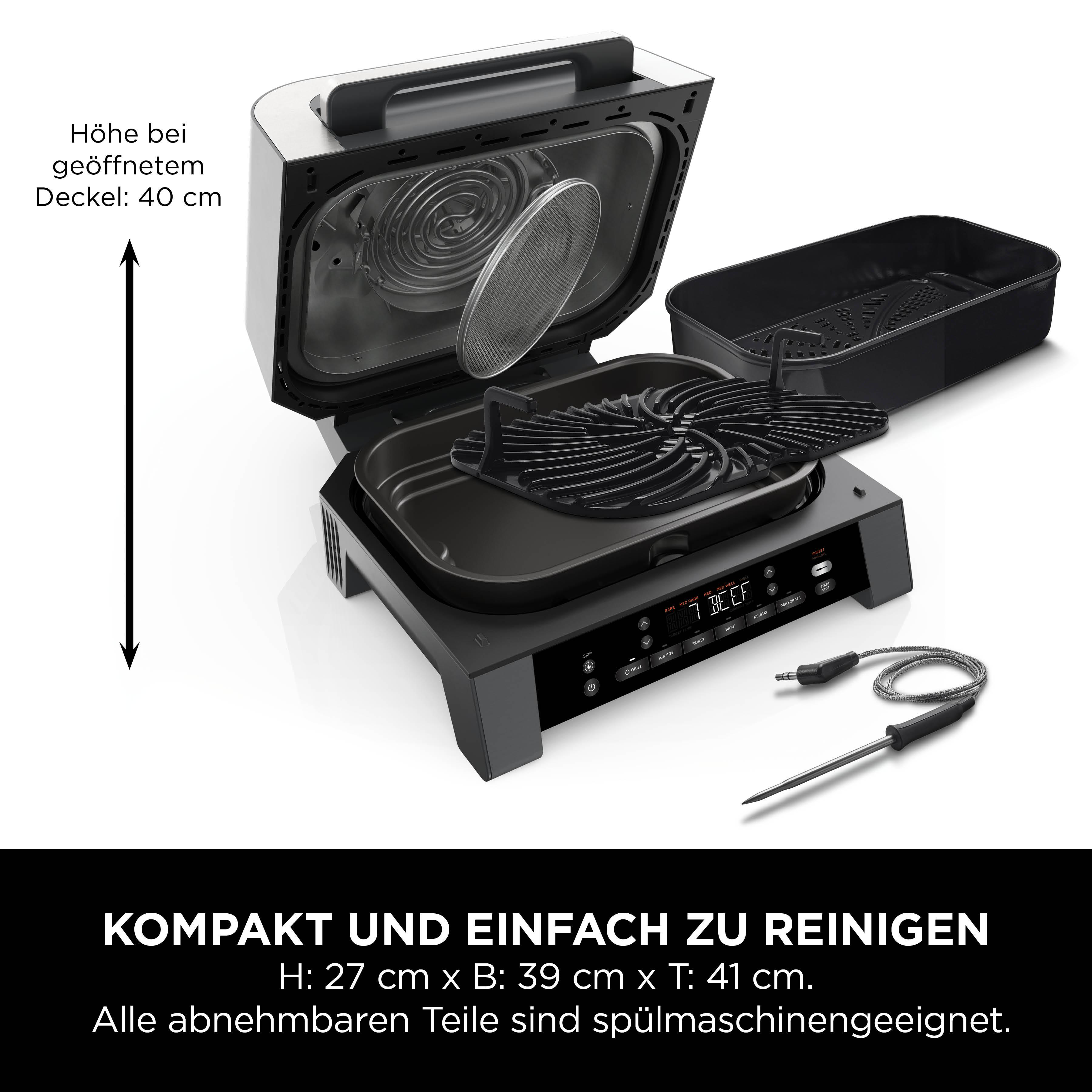 Heißluftfritteuse mit geöffnetem Deckel und Zubehör. Schwarz-Silber-Farbschema.