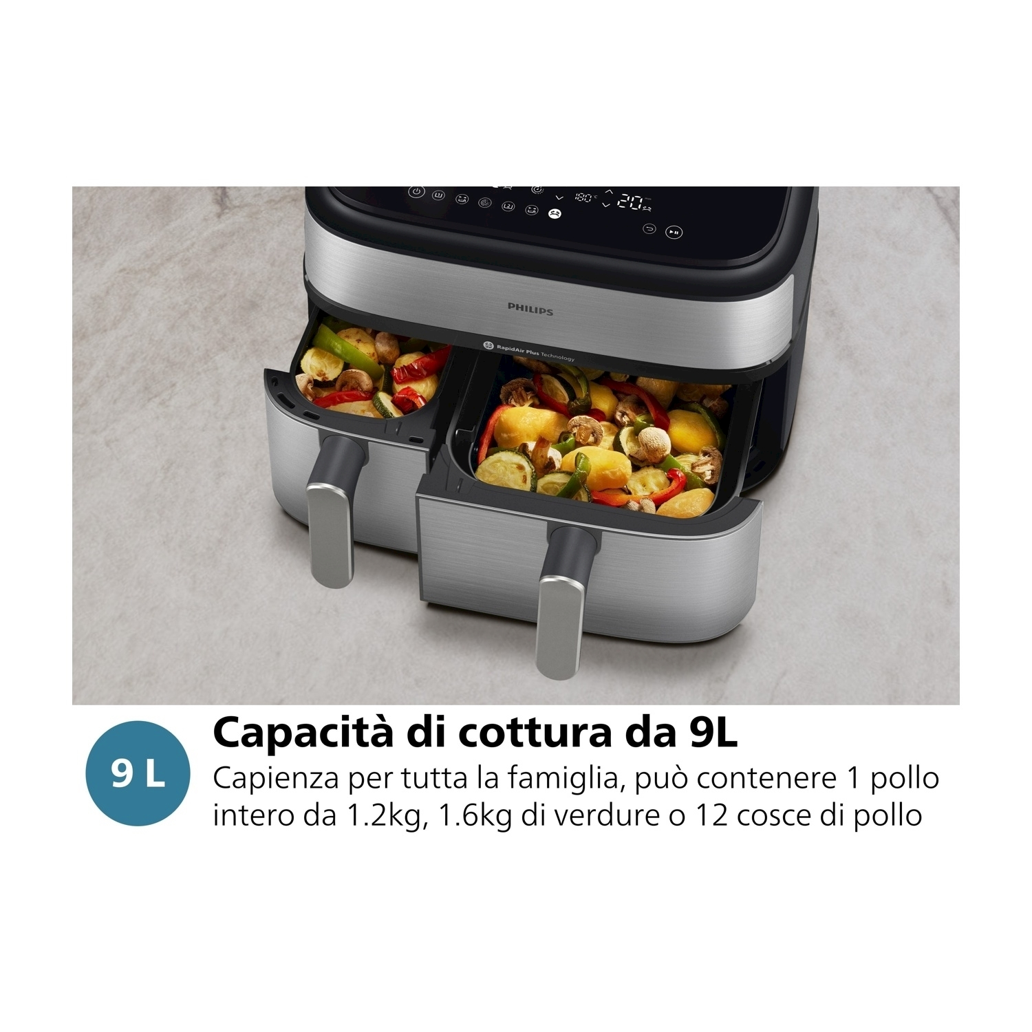 Friggitrice ad aria con due cestelli, ripieni di verdure cotte.