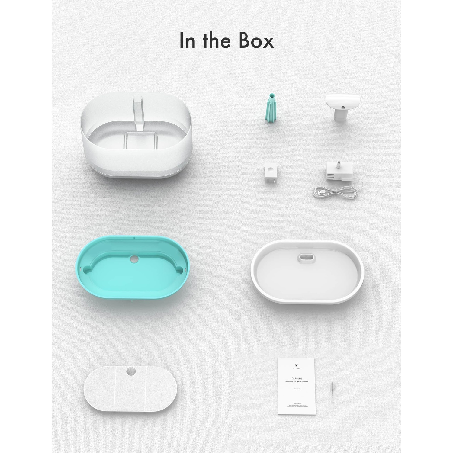 Image shows the parts of a pet feeder. Includes bowls, filter, pump, and other components, arranged on a white surface.