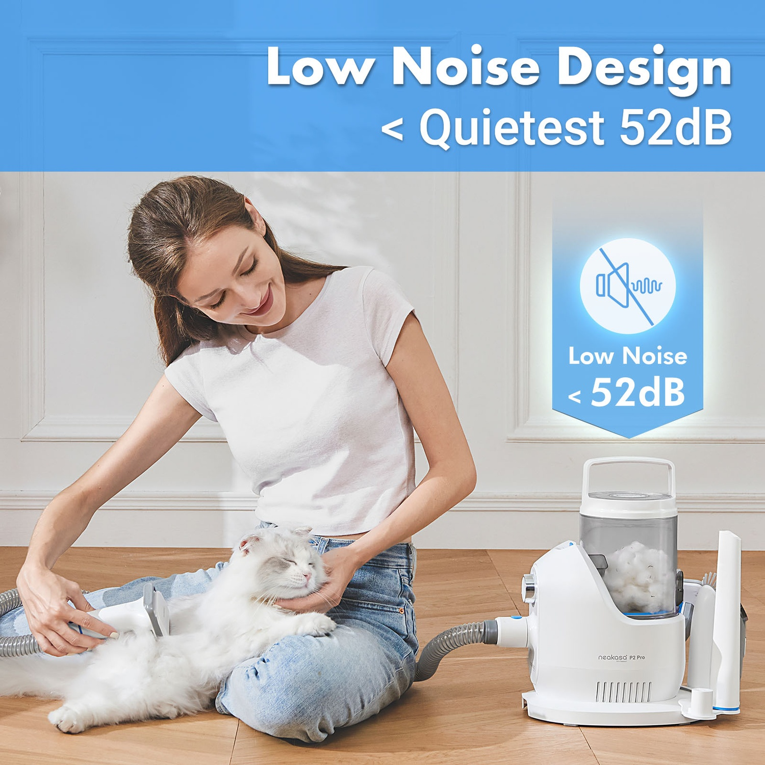 A woman petting a white cat while using a pet grooming vacuum cleaner. Text says Low Noise Design <lt/> Quietest 52dB.