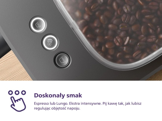 Zbliżenie ekspresu do kawy z przyciskami i pojemnikiem na ziarna kawy. Tekst mówi 'Idealny smak'.