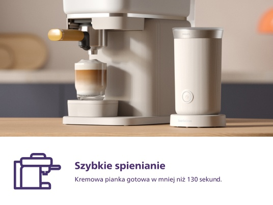 Biały ekspres do kawy dozujący kawę z spieniaczem do mleka.