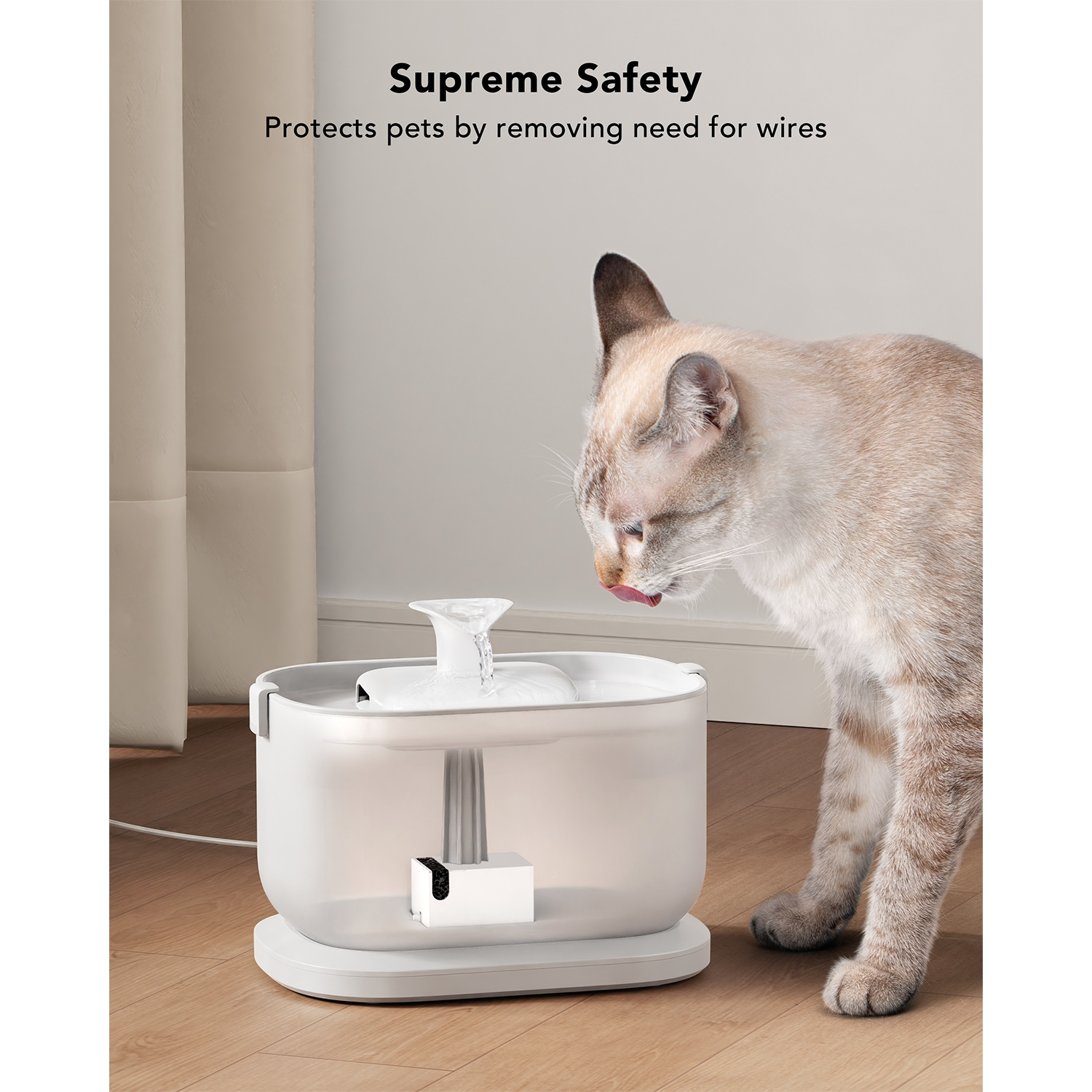 A cat drinking from a white pet water fountain, with a blurred background.