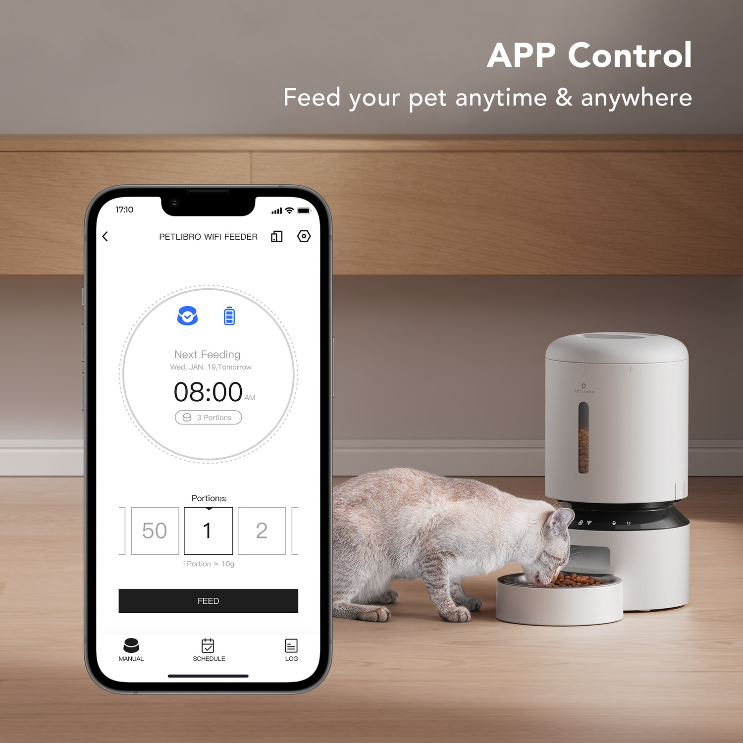 A cat eating from a bowl. A phone shows an app to control the pet feeder. The feeder is in the background.