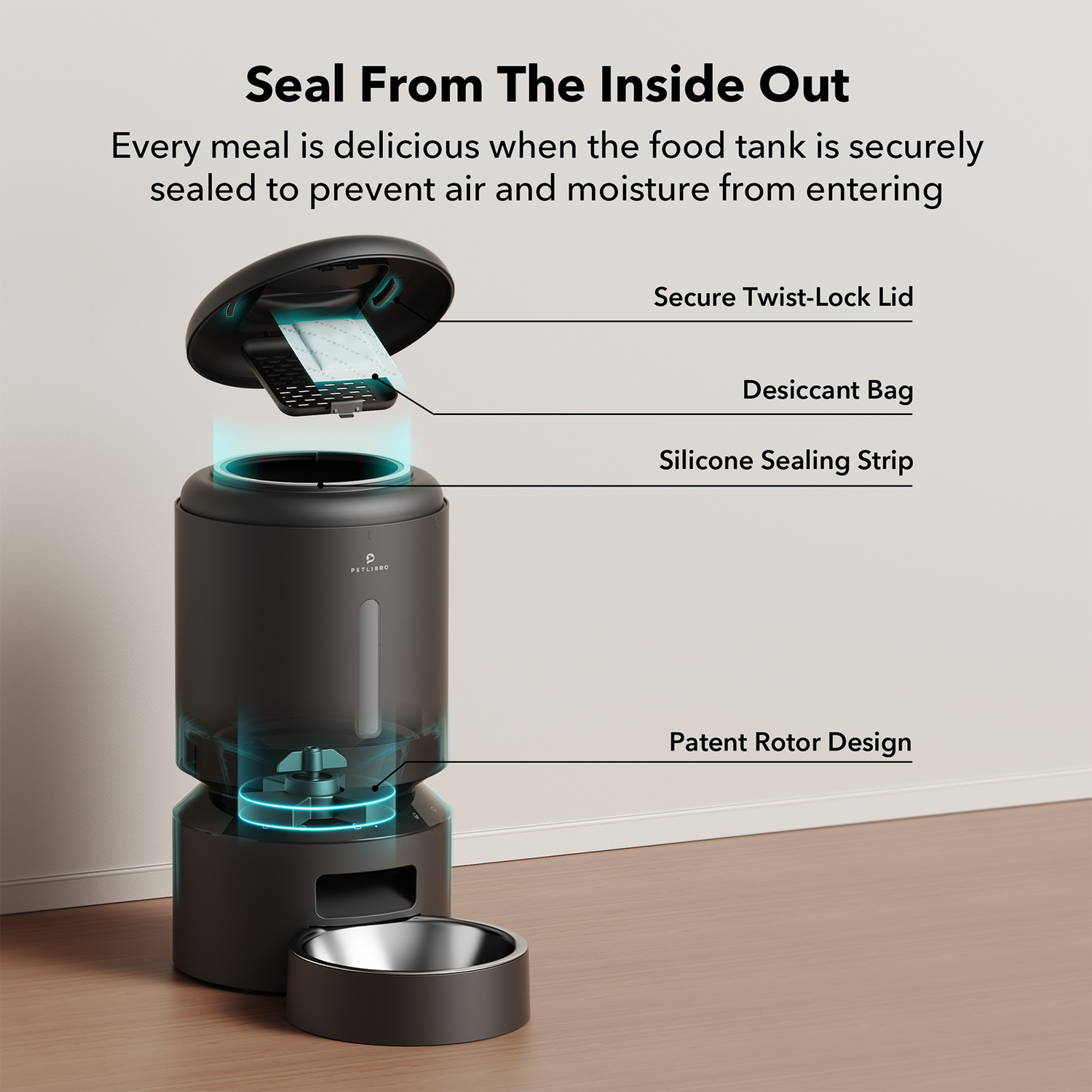Black pet food dispenser with opened lid, desiccant bag, and bowl. Text labels present.