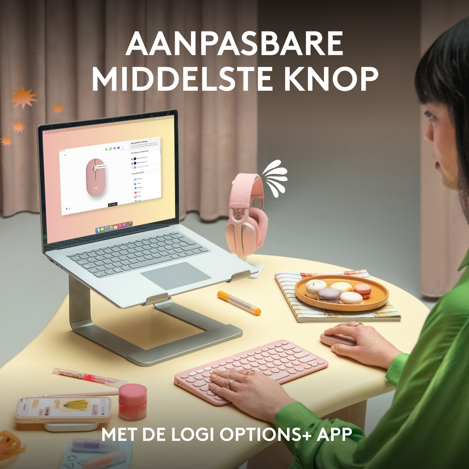 A woman is using a computer with a laptop and other devices.