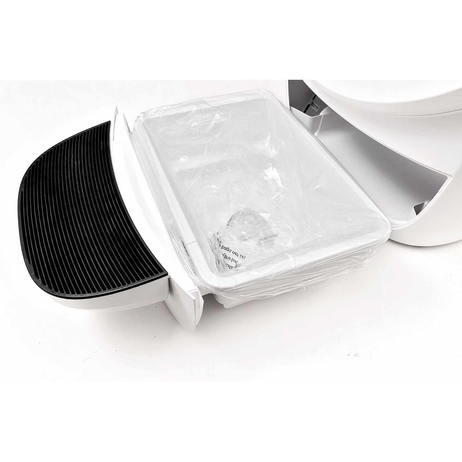 A white pet waste container with a clear plastic bag inside. The container is open and ready to use.