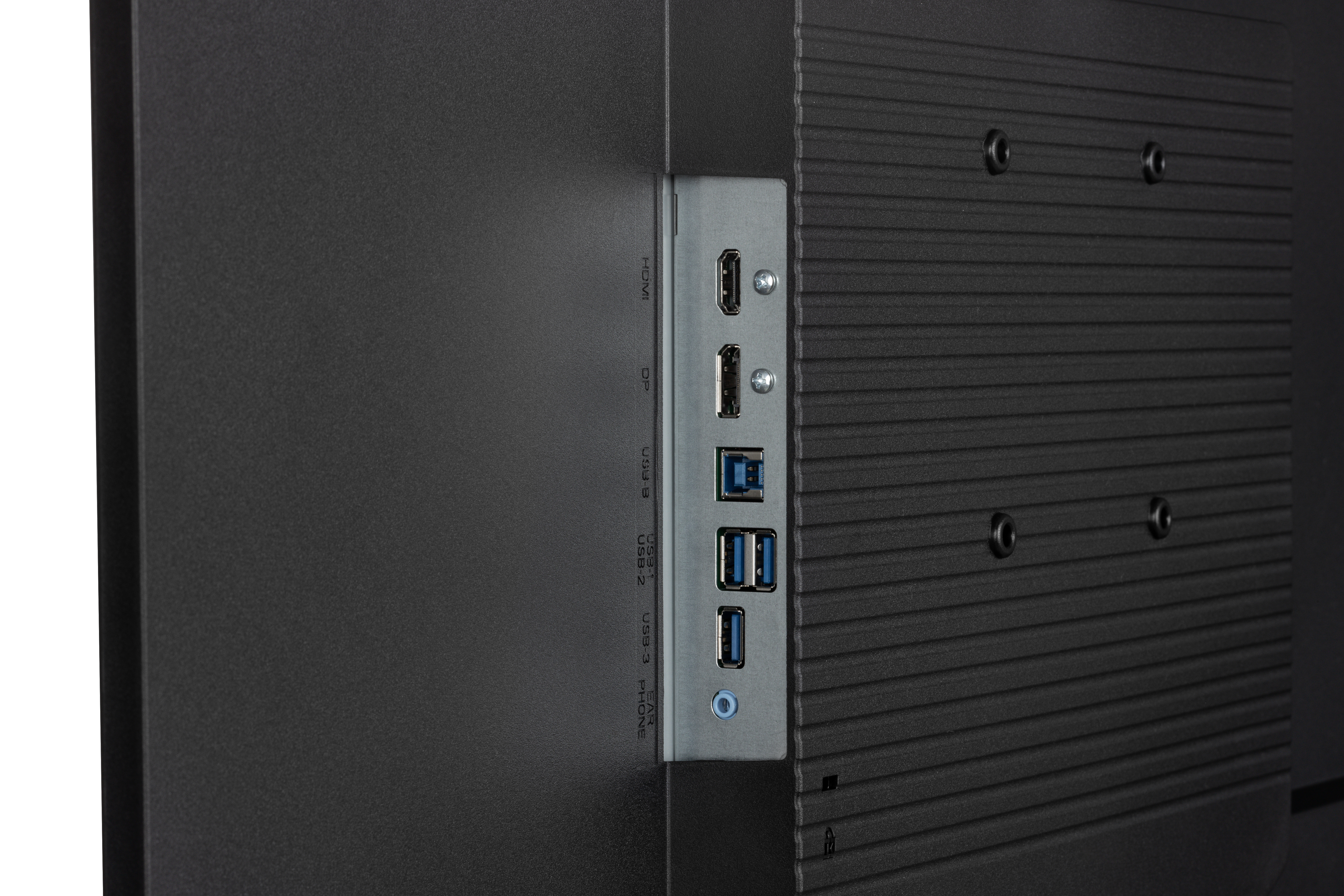 Zbliżenie tyłu czarnego ekranu, pokazujące porty HDMI, USB i audio.