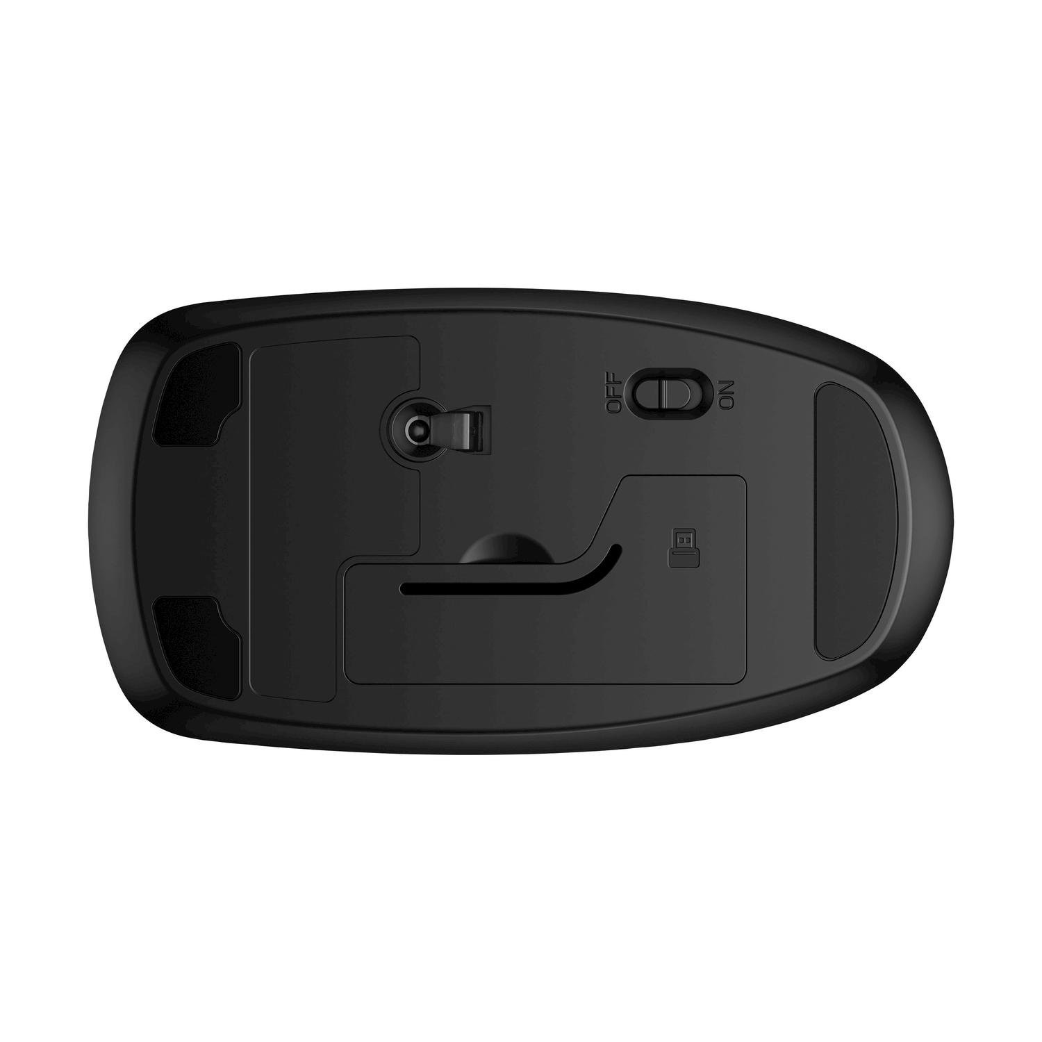 Il fondo di un mouse per computer nero. Un interruttore e un vano sono visibili.