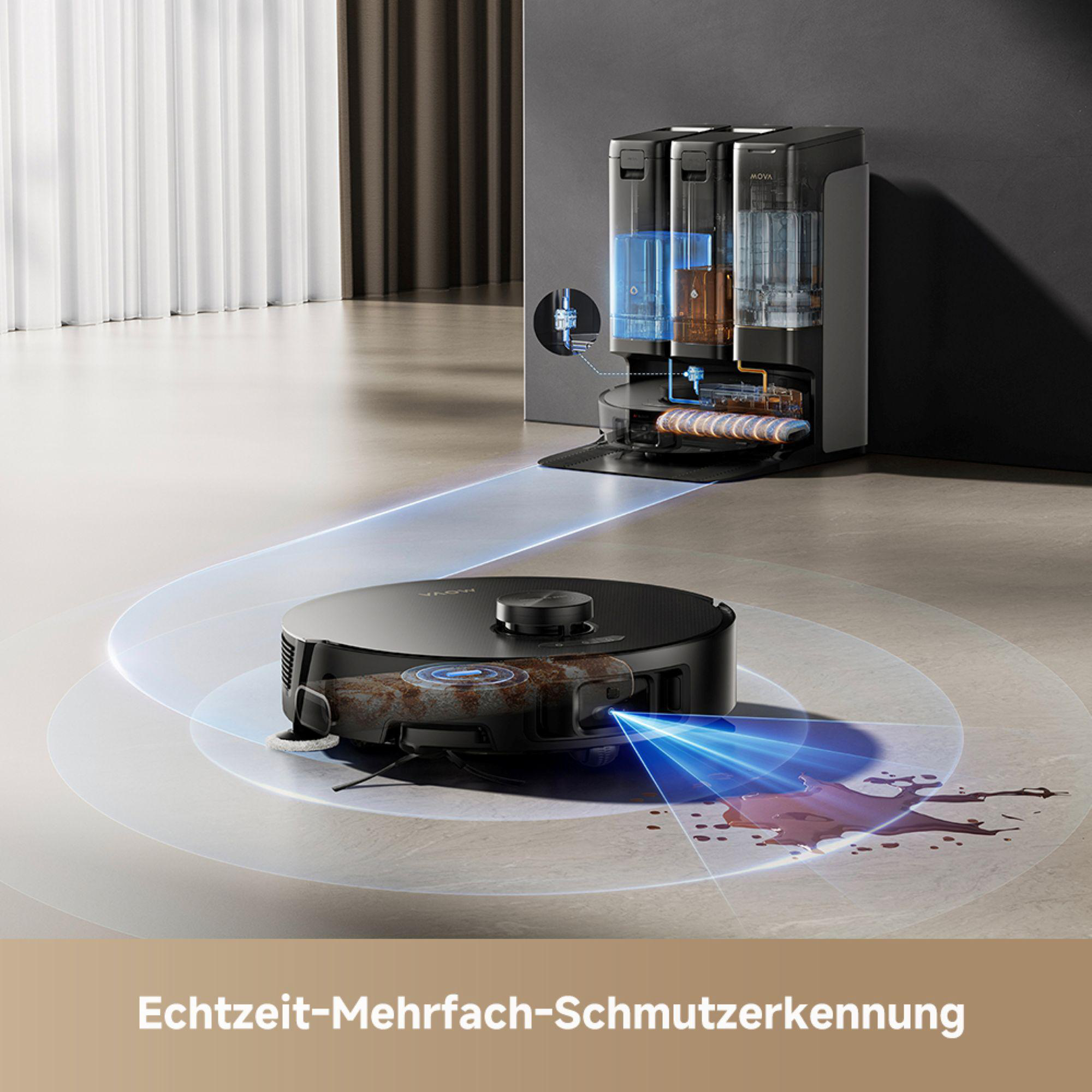 Ein schwarzer Roboter-Staubsauger reinigt den Boden. Er befindet sich in der Nähe einer Wand und eines Schranks.