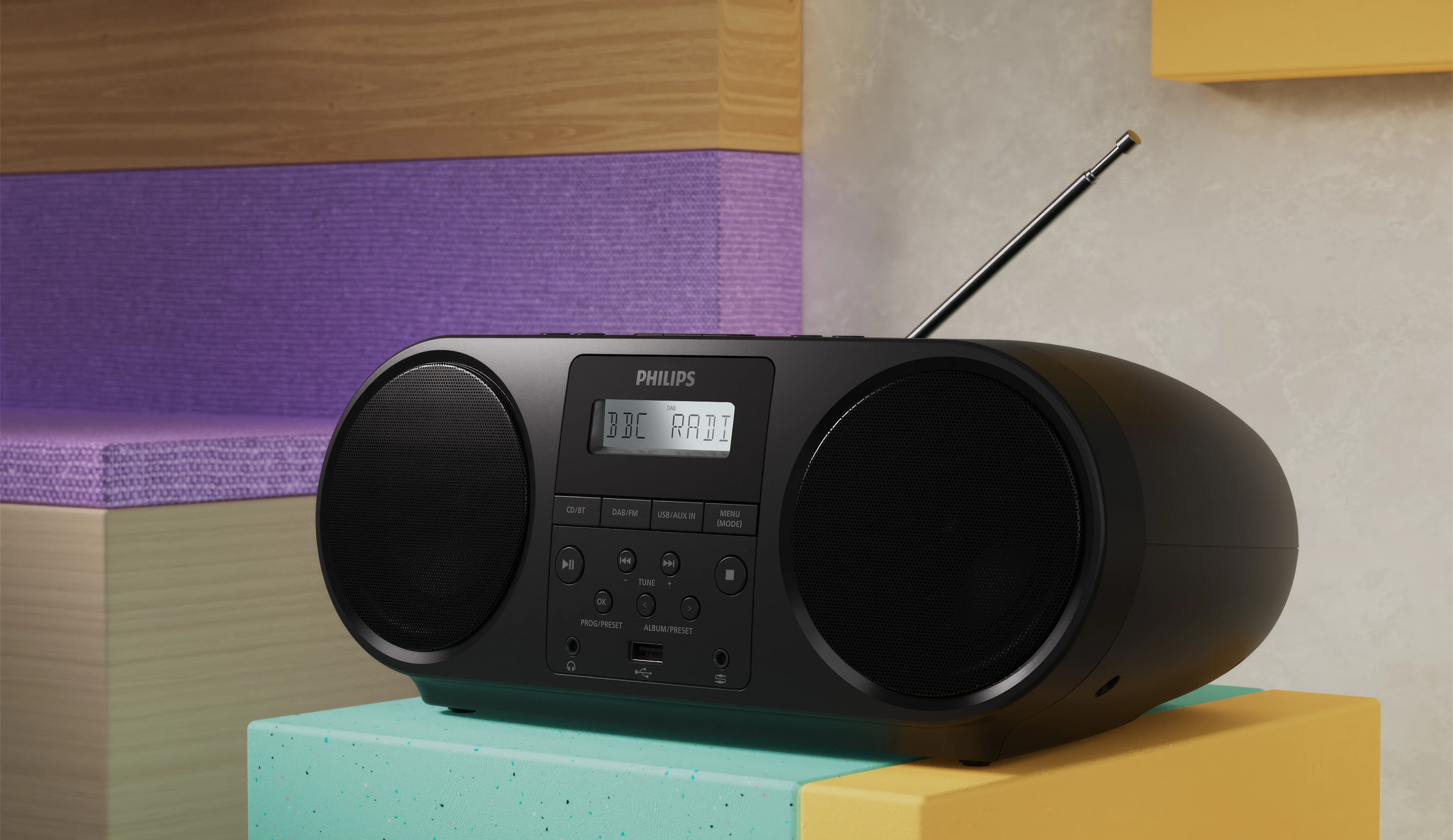 Una radio stereo nera su un supporto colorato.