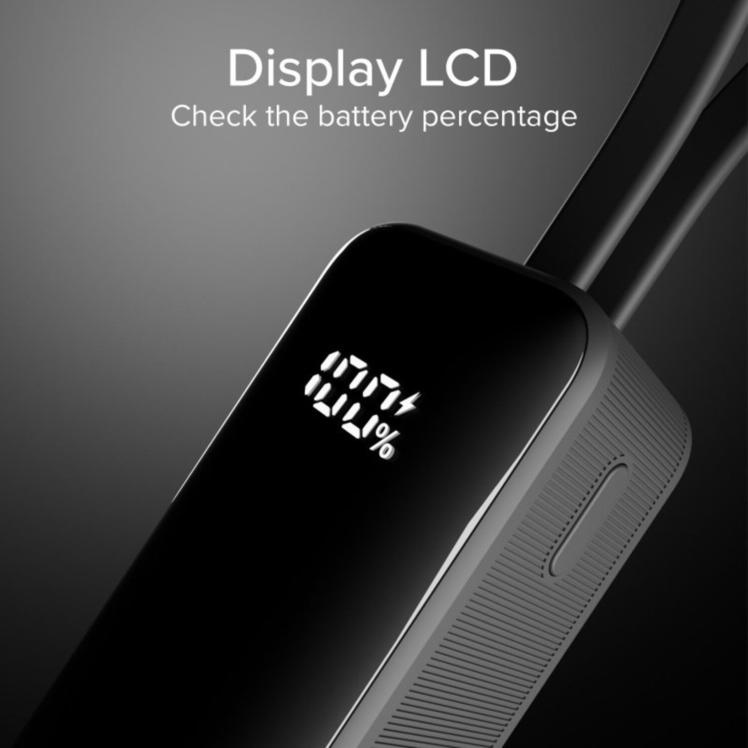 Gros plan d'un appareil noir avec un écran affichant le pourcentage de batterie. Fond gris.