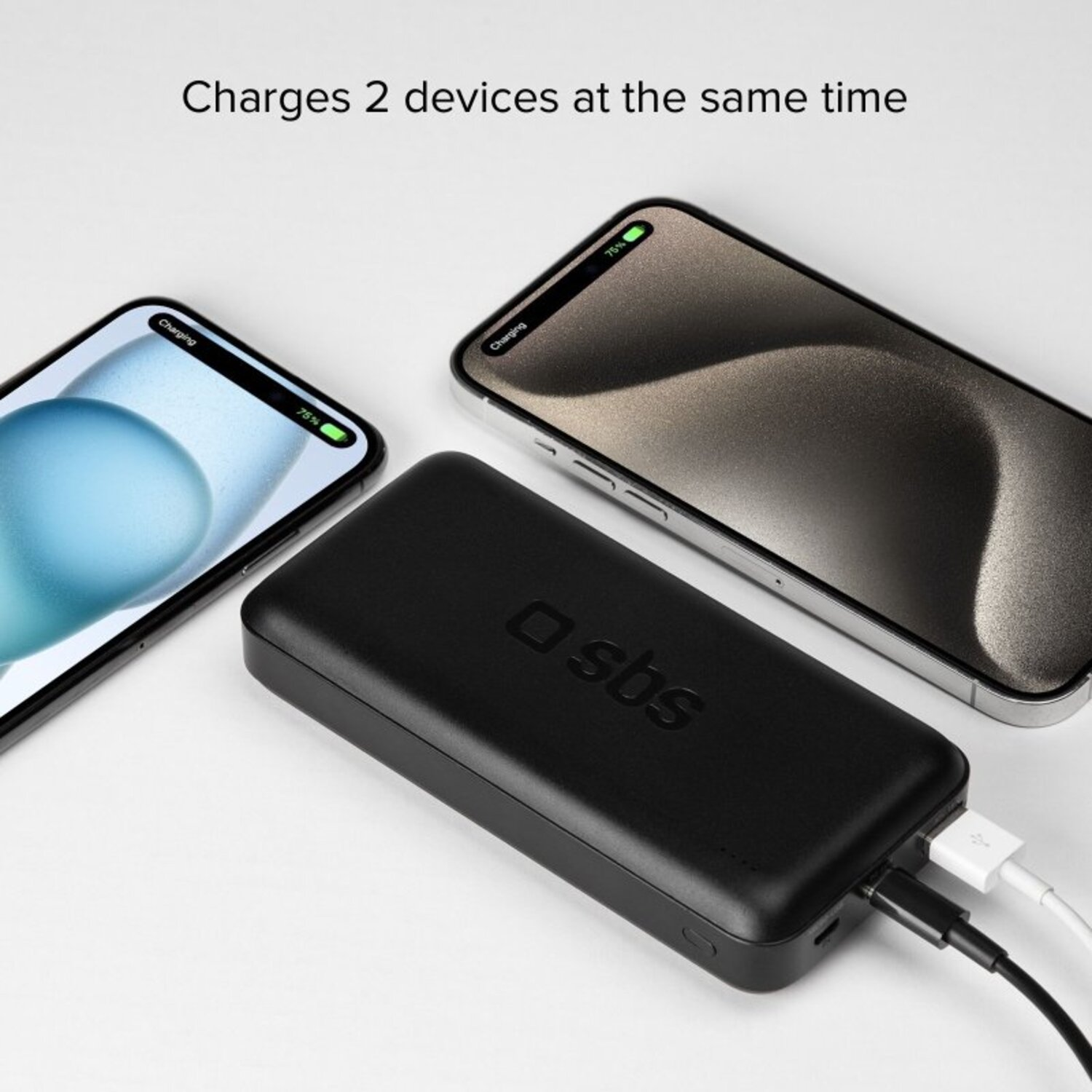 Black power bank with two phones charging. Phones show 75% charge. Text: Charges 2 devices at the same time.