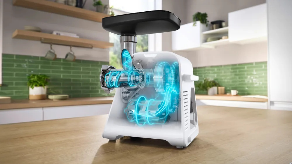 Maszynka do mięsa w akcji, z widocznymi częściami wewnętrznymi i animowanymi efektami świetlnymi.