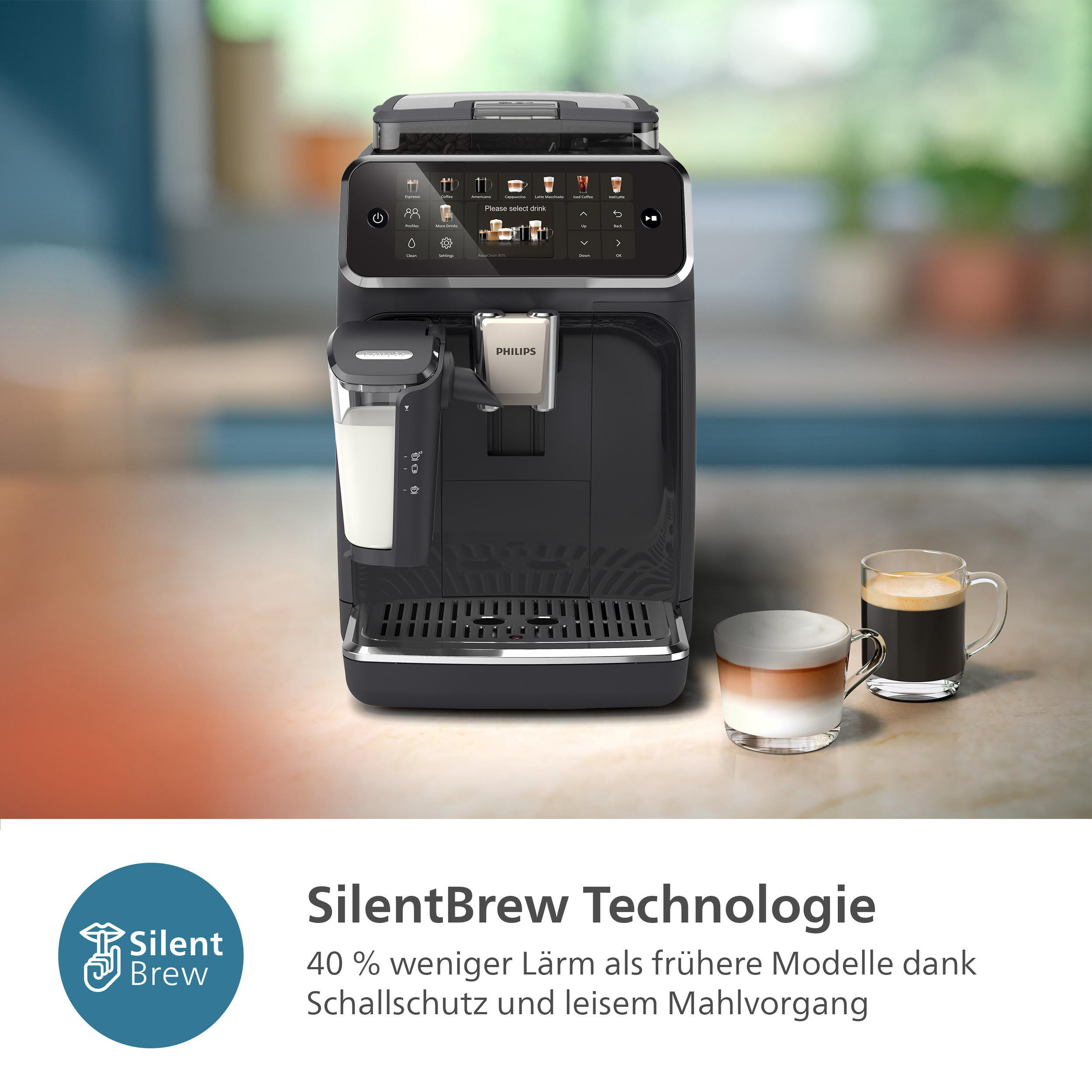 Schwarze Philips-Kaffeemaschine mit Milchaufschäumer und zwei Kaffeetassen.