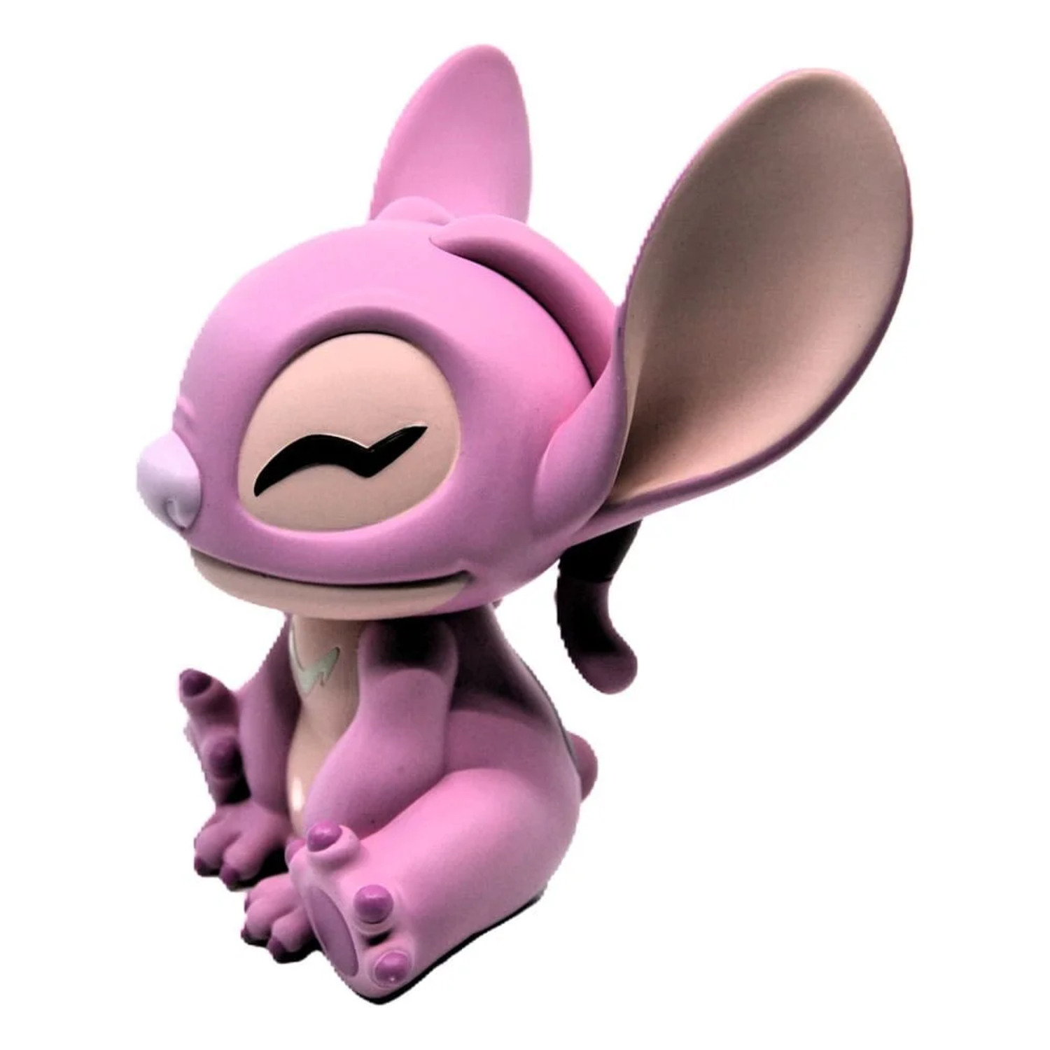 Pink Angel, a character from Lilo & Stitch, sitting with closed eyes. It has large ears, small arms, and a tail.