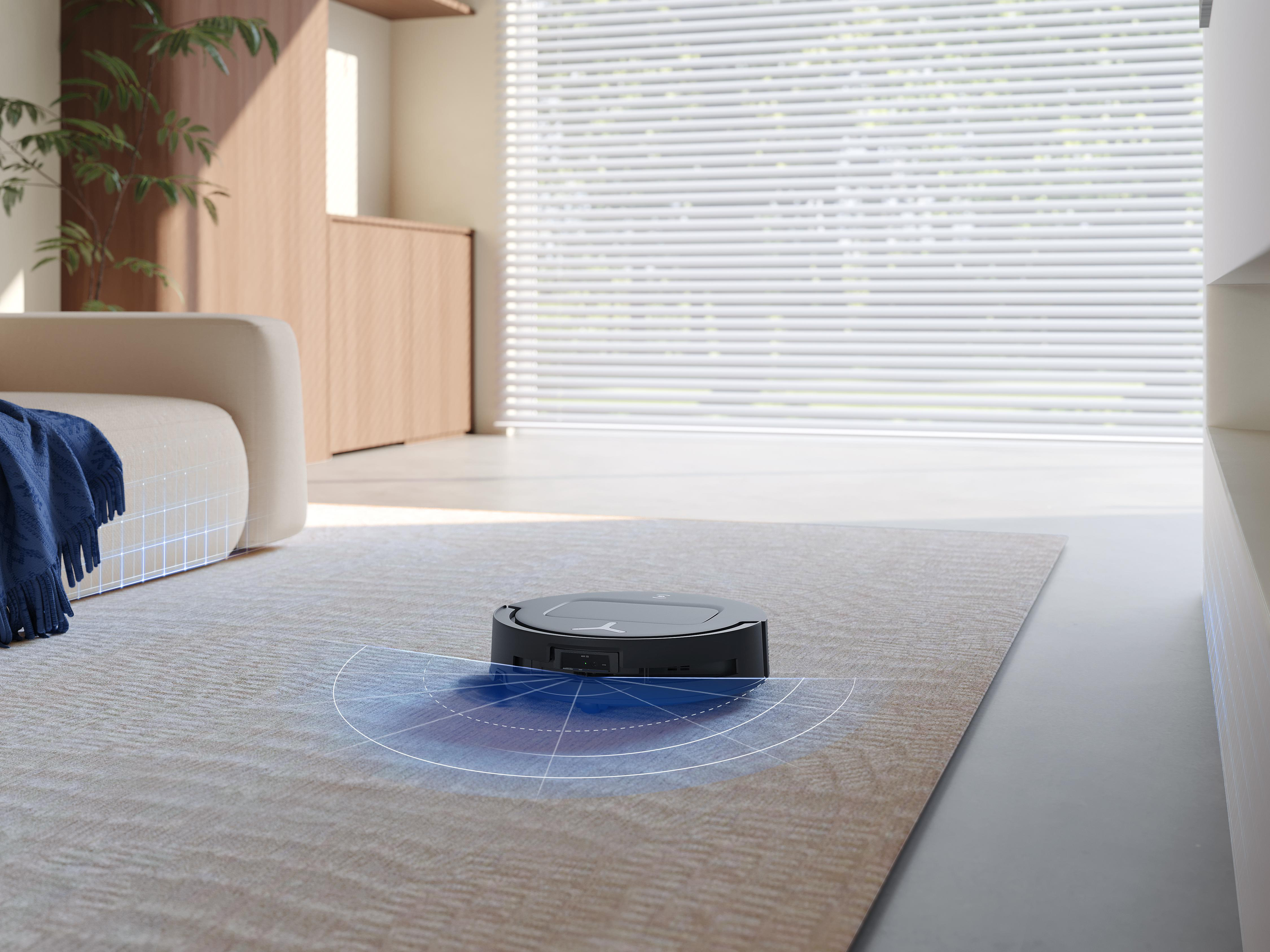 Roboter-Staubsauger auf einem Teppich, mit markiertem blauem Scanbereich.