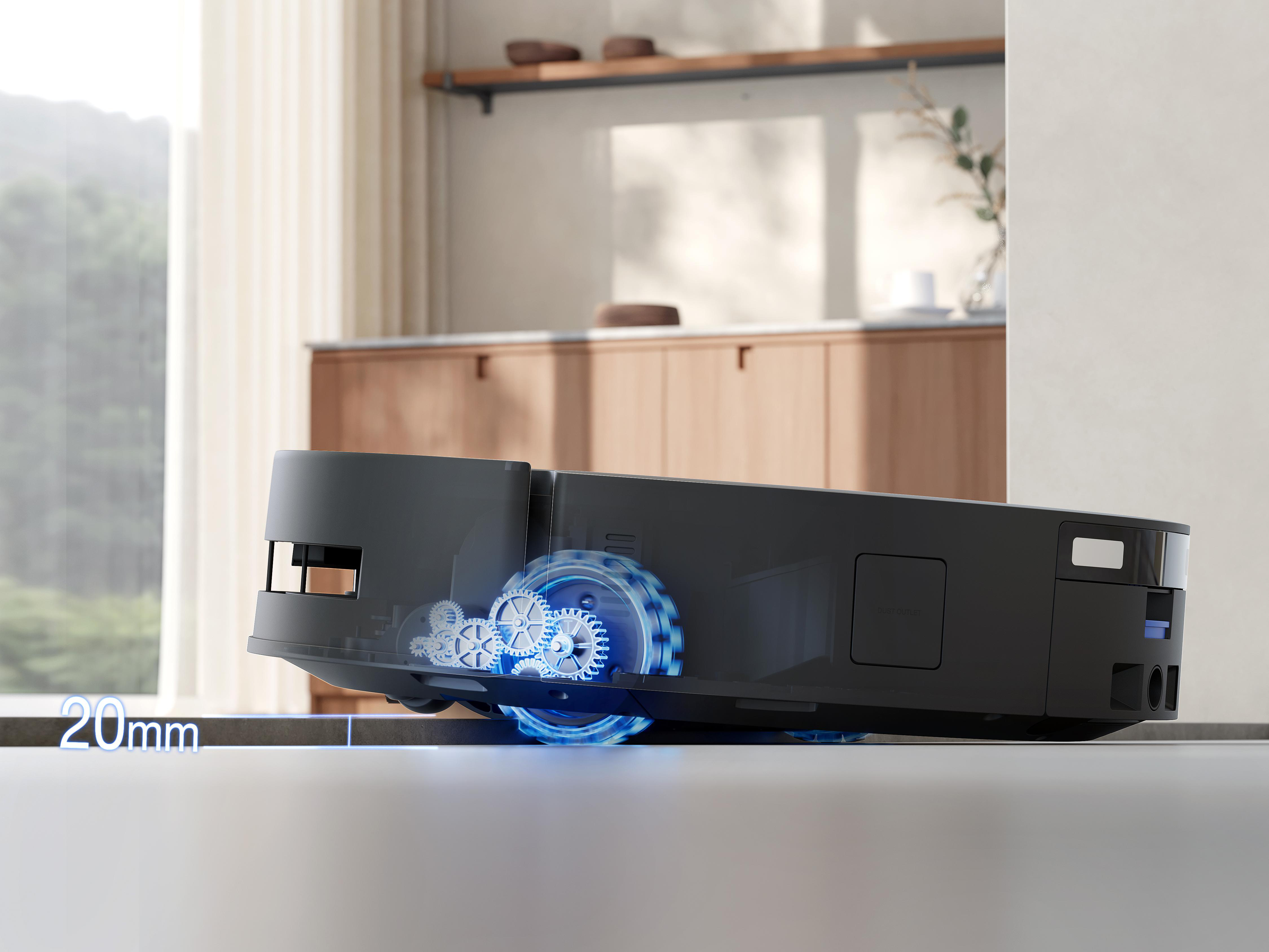 Schwarzer Roboter-Staubsauger auf einem Boden, zeigt interne Zahnräder und blaue Lichter.
