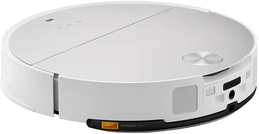 Un aspirapolvere robot bianco. Ha una forma rotonda. La parte superiore ha un piccolo pulsante. Sfondo bianco.