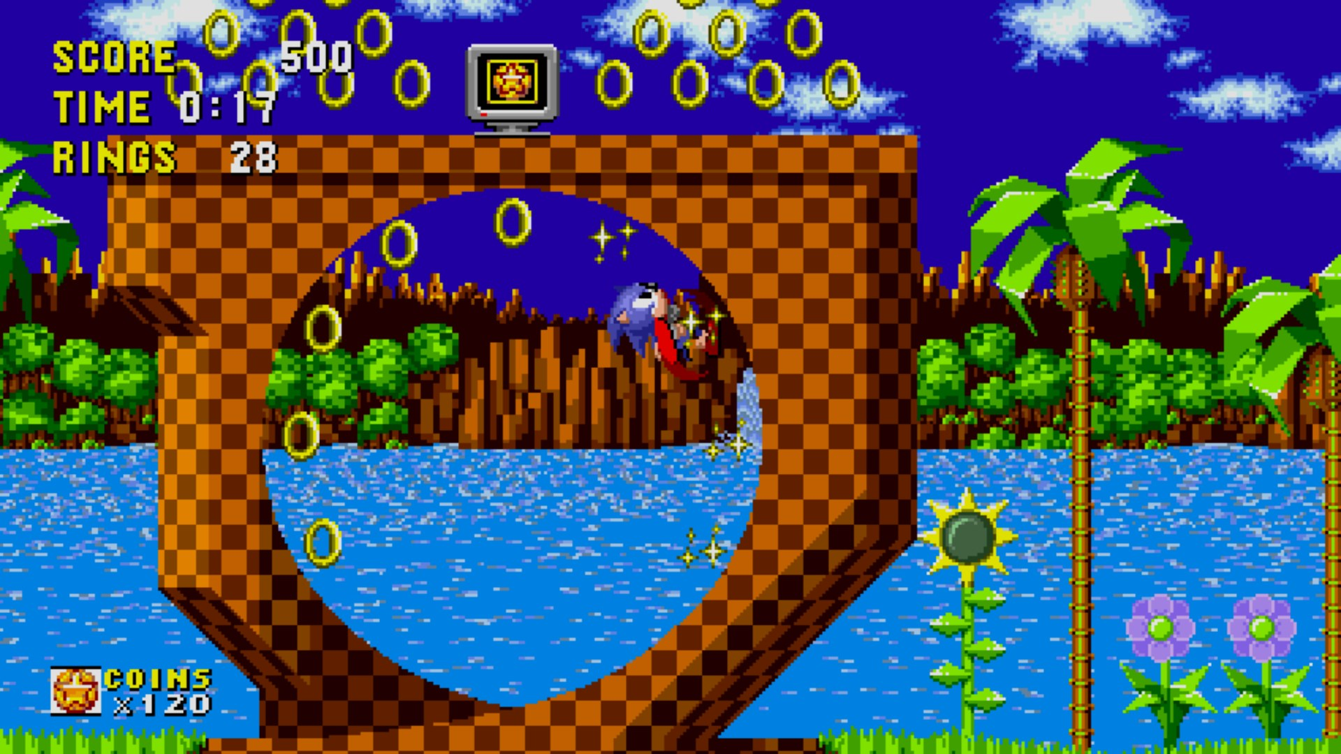 Sonic the Hedgehog salta attraverso un loop, anelli e punteggio in alto.