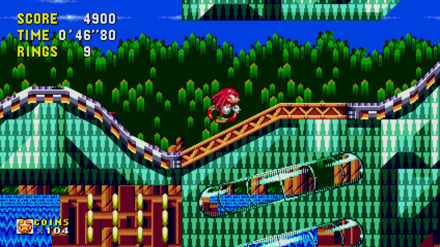 Knuckles corre su un ponte in un paesaggio verde pixelato.