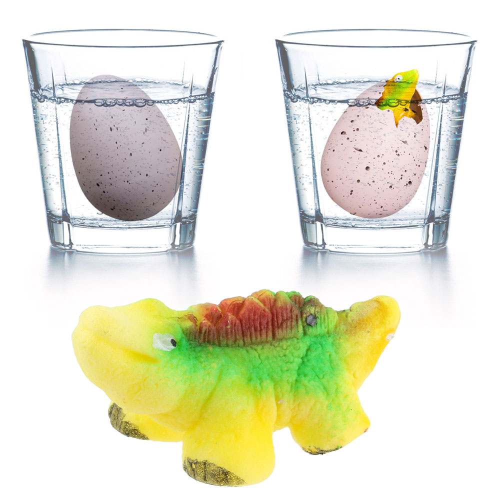 Dos vasos de agua con huevos dentro. Un huevo es sólido, el otro ha eclosionado con un pequeño dinosaurio emergiendo.