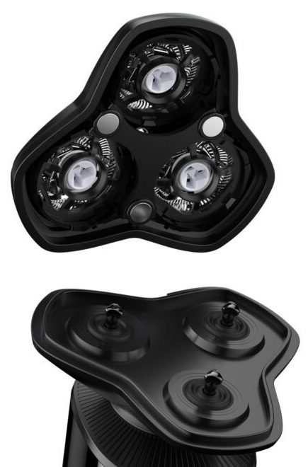 Zbliżenie głowic golarki elektrycznej, czarne ze srebrnymi elementami.