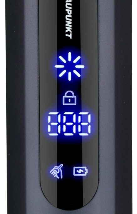 Zbliżenie czarnego ekranu urządzenia z podświetlanymi na niebiesko symbolami i numerami.