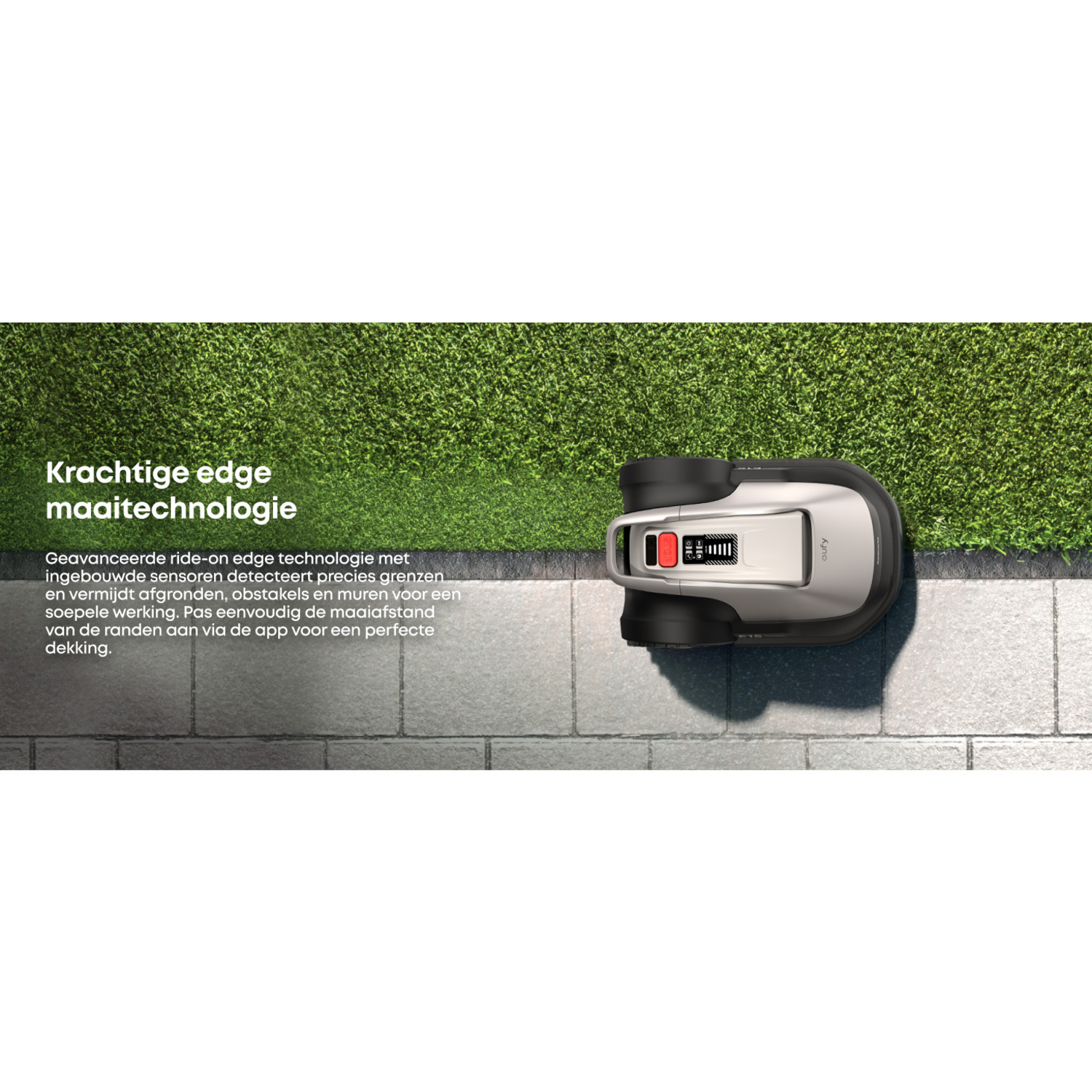 Een robotmaaier snijdt gras met een close-up op een gazonrand.