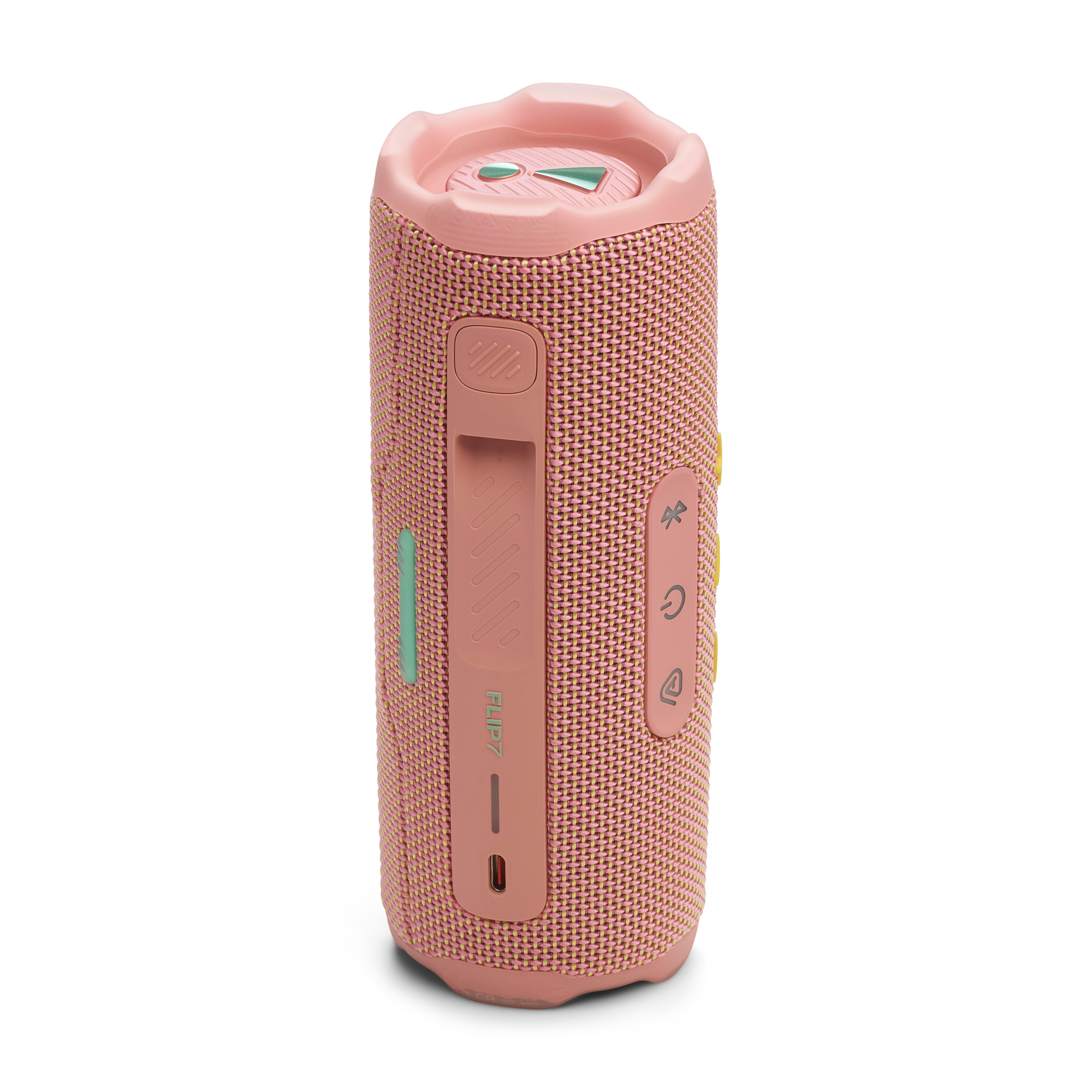 Ein rosa JBL Flip 6 Lautsprecher, mit Steuertasten. Auf weißem Hintergrund.