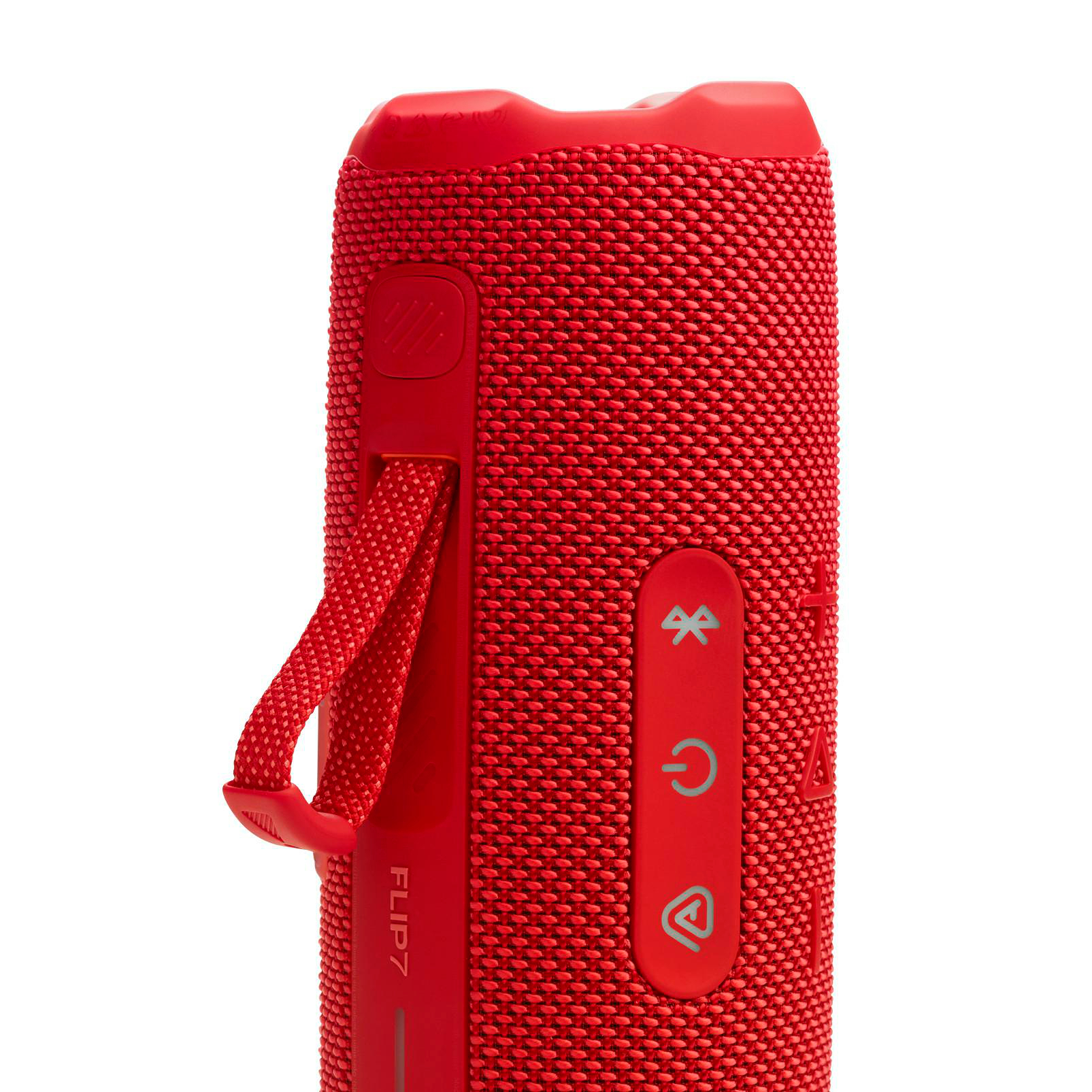 Roter JBL Flip 7 Lautsprecher, mit Knöpfen und einem Trageriemen. Der Lautsprecher ist zylindrisch.