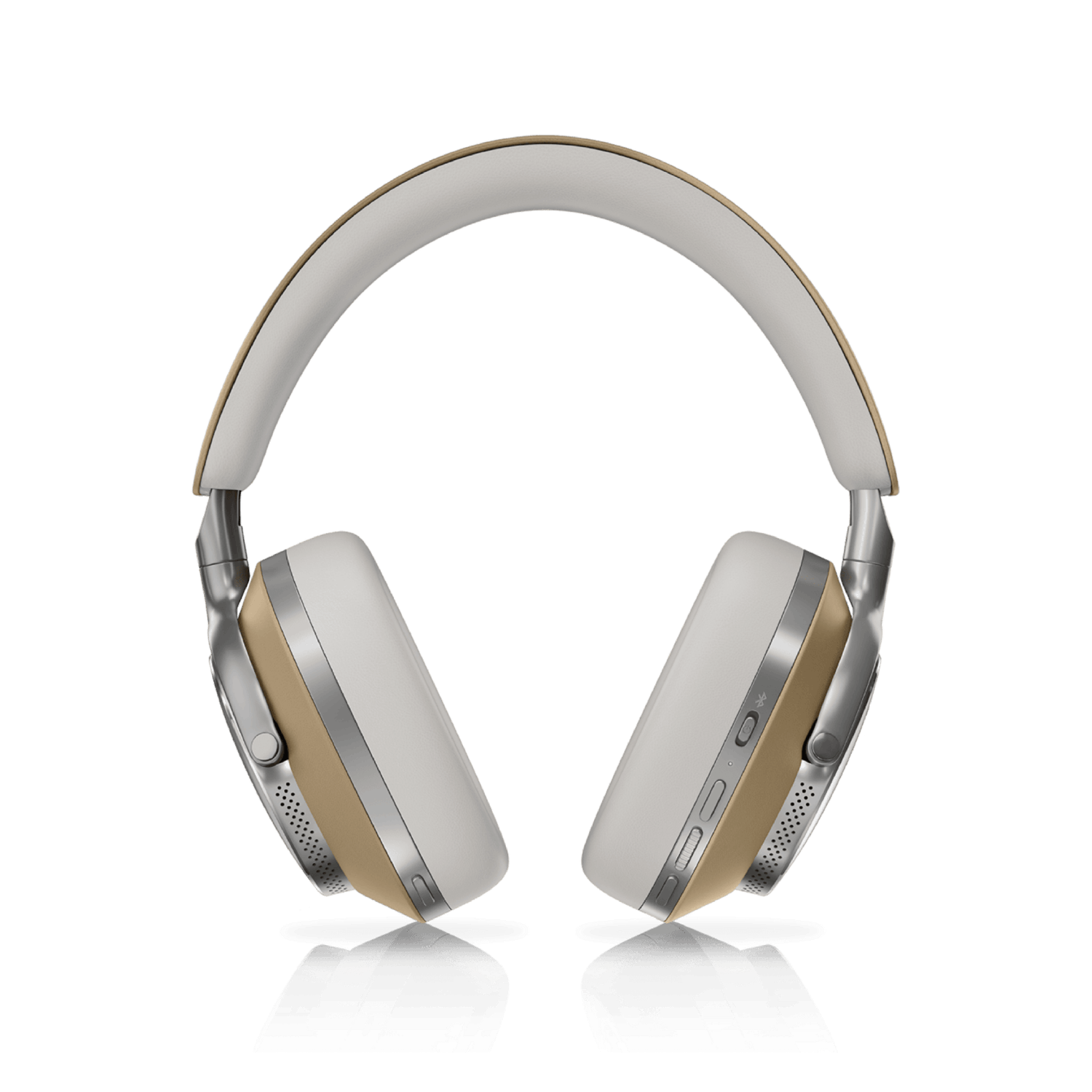 Auriculares blancos y dorados sobre una superficie negra, reflejados abajo, contra un fondo negro.