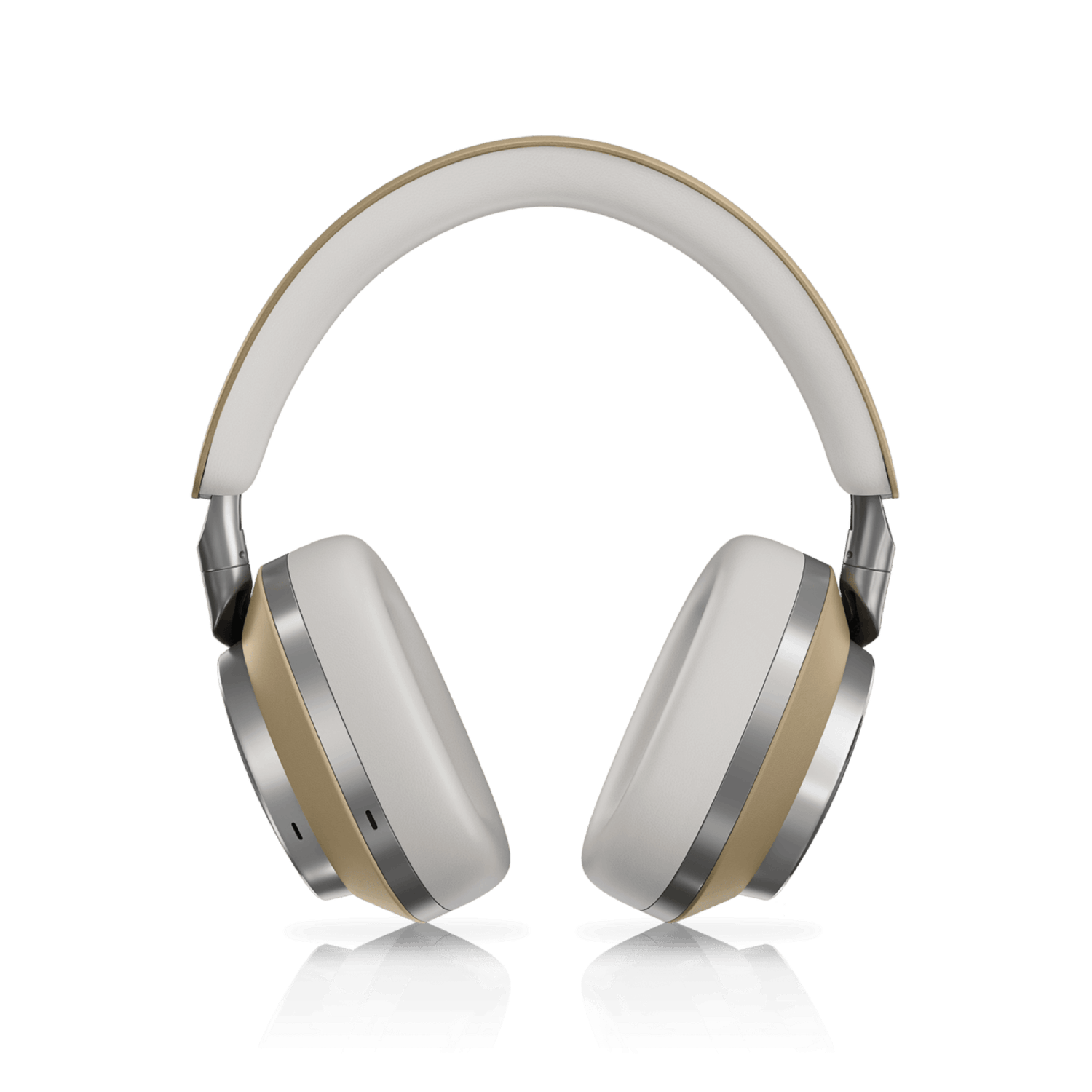 Auriculares blancos y dorados sobre una superficie negra, reflejando la luz.