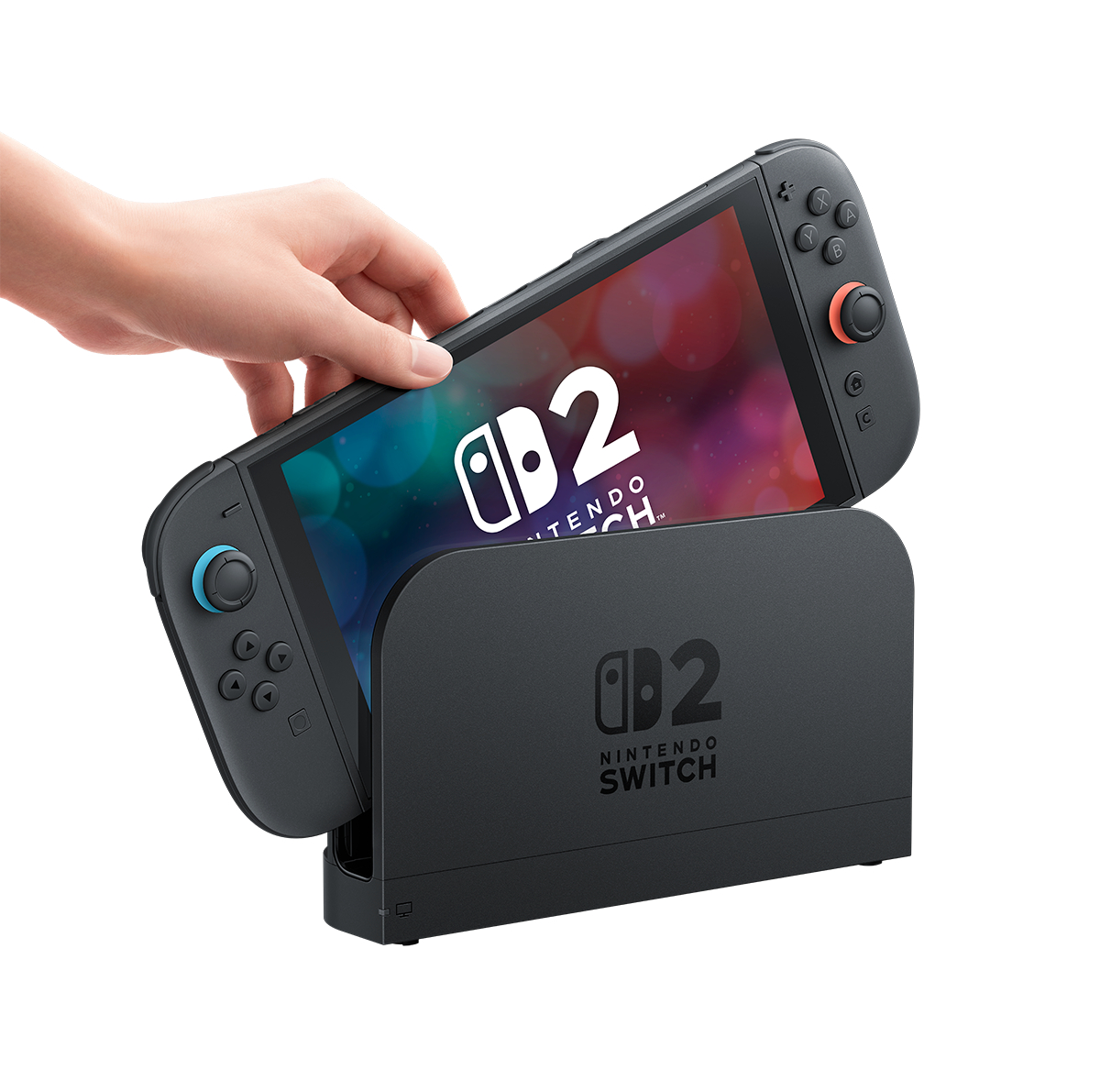 Eine schwarze Nintendo Switch-Konsole ist teilweise angedockt, mit einer Hand, die einen Controller hält.