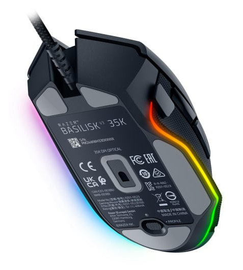 Mysz do gier, widok od spodu. Razer Basilisk V3 35K. Widoczne etykiety i logo, wielokolorowe oświetlenie.
