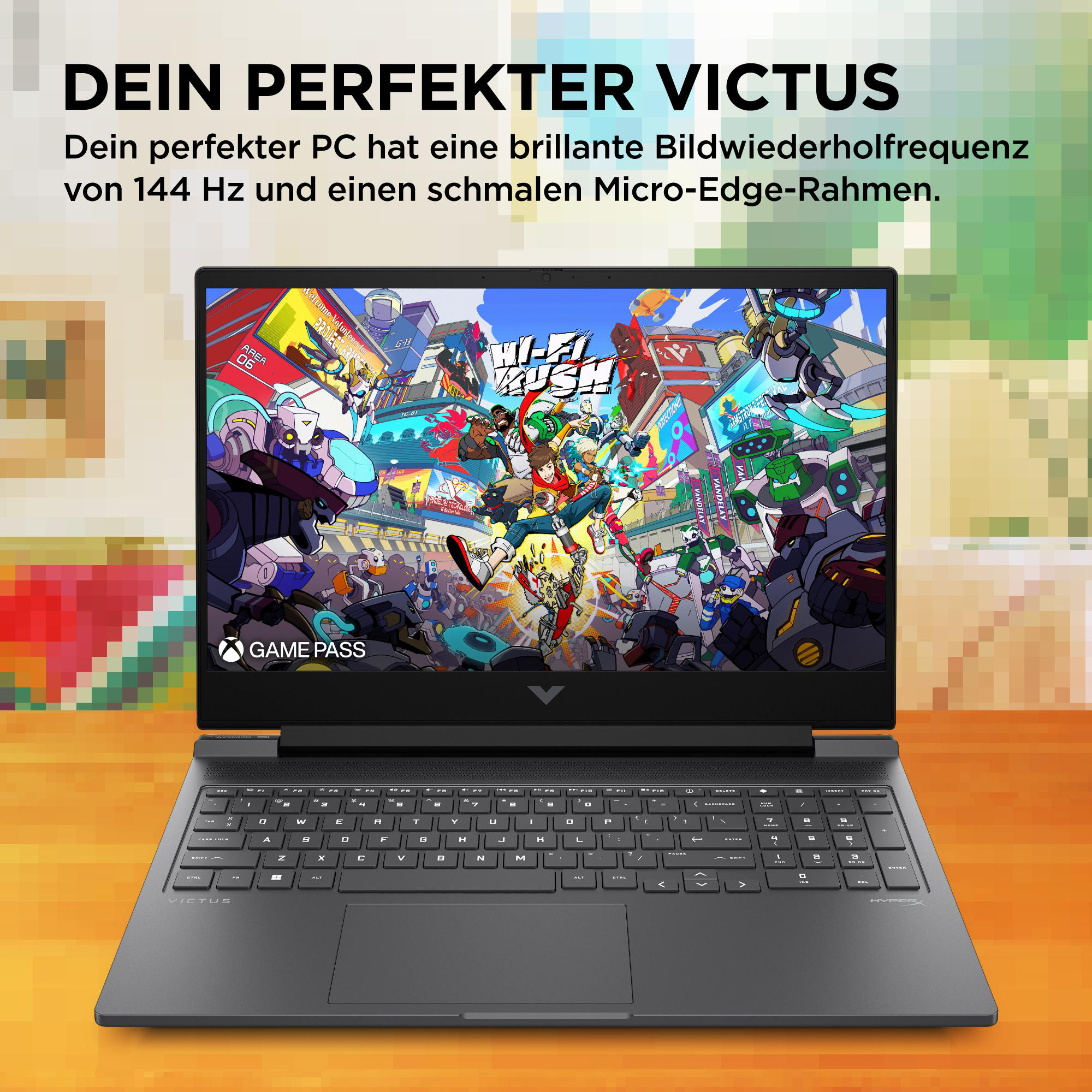 Schwarzer Laptop zeigt einen bunten Spielbildschirm auf Holz, mit unscharfem Hintergrund.